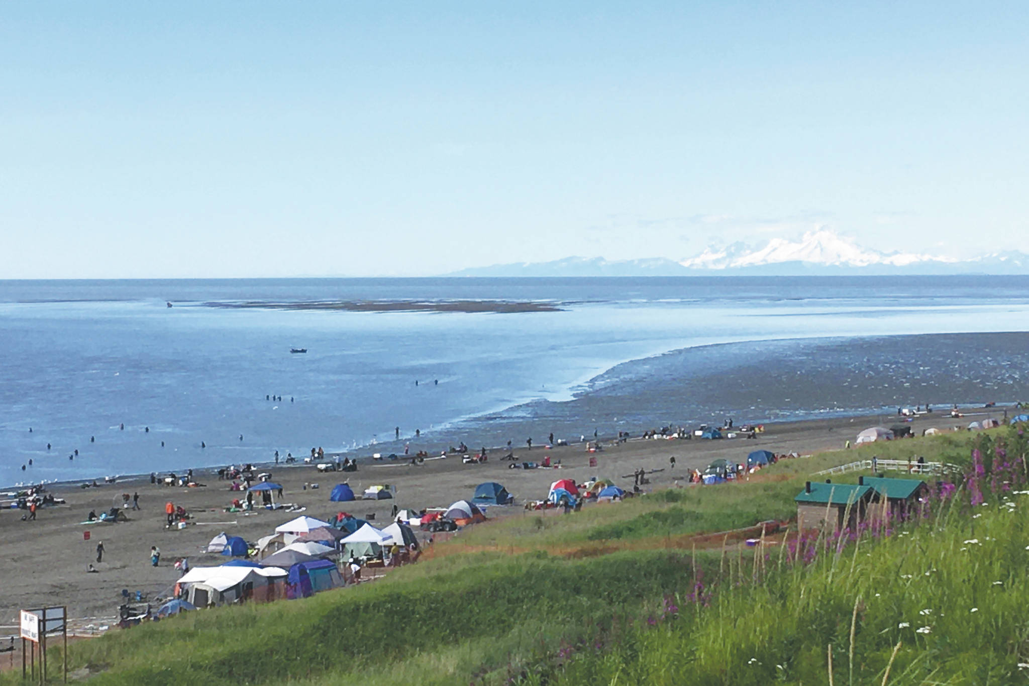 Dipnetters line North Kenai Beach in Kenai, Alaska, on July 20, 2020. (Photo by Jeff Helminiak/Peninsula Clarion)