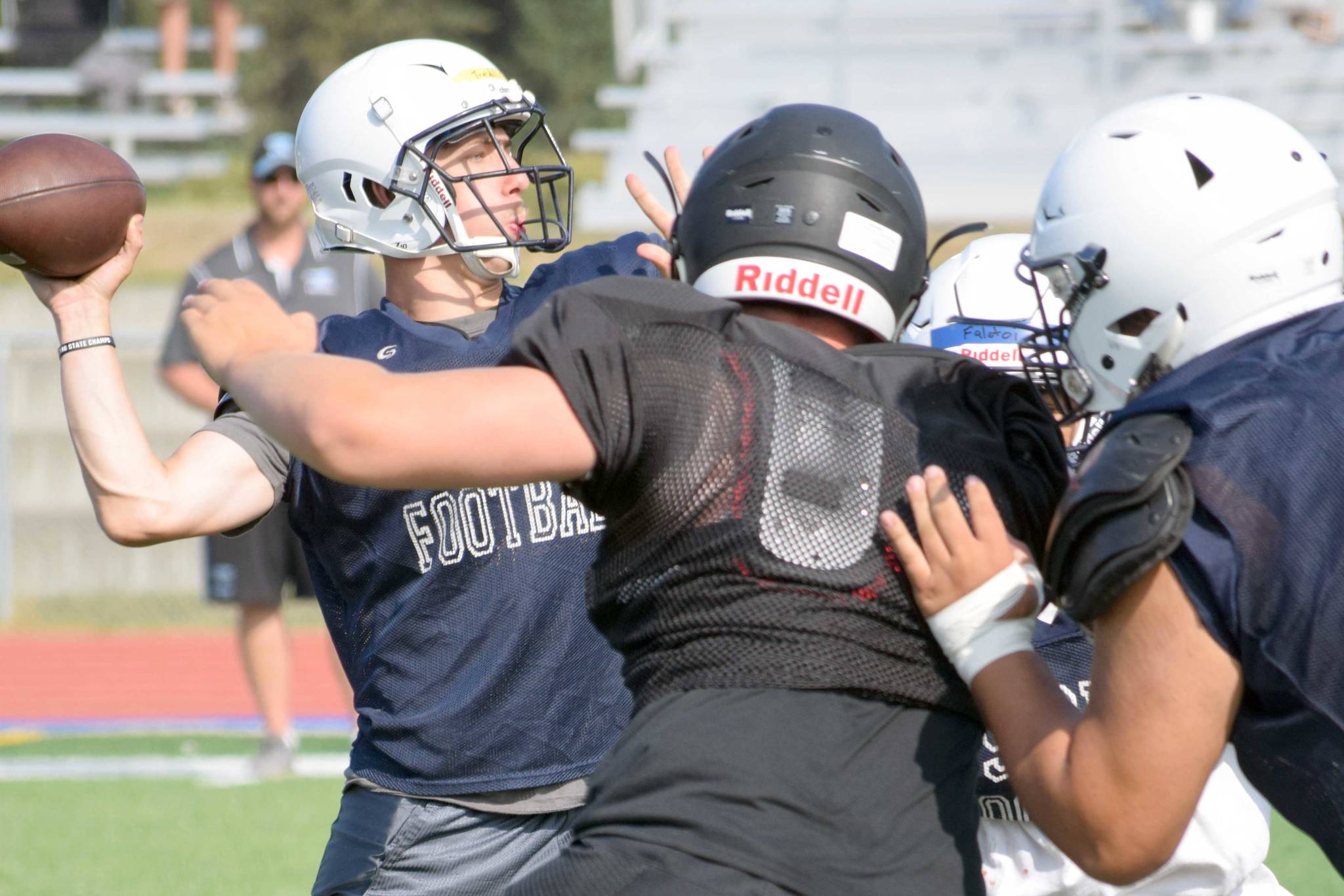 Soldotna’s Jersey Truesdell prepares to loft a pass in a scrimmage against Chugiak on Saturday, Aug. 10, 2019, at Justin Maile Field in Soldotna, Alaska. (Photo by Jeff Helminiak/Peninsula Clarion)