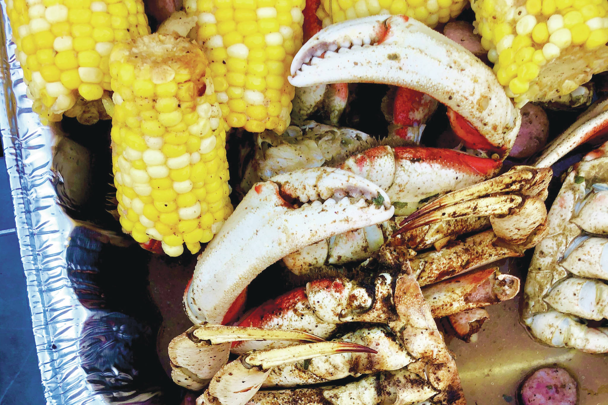 A crab boil to celebrate a friends birthday, on Sunday, Aug. 16, 2020 in Anchorage, Alaska. (Photo by Victoria Petersen/Peninsula Clarion)