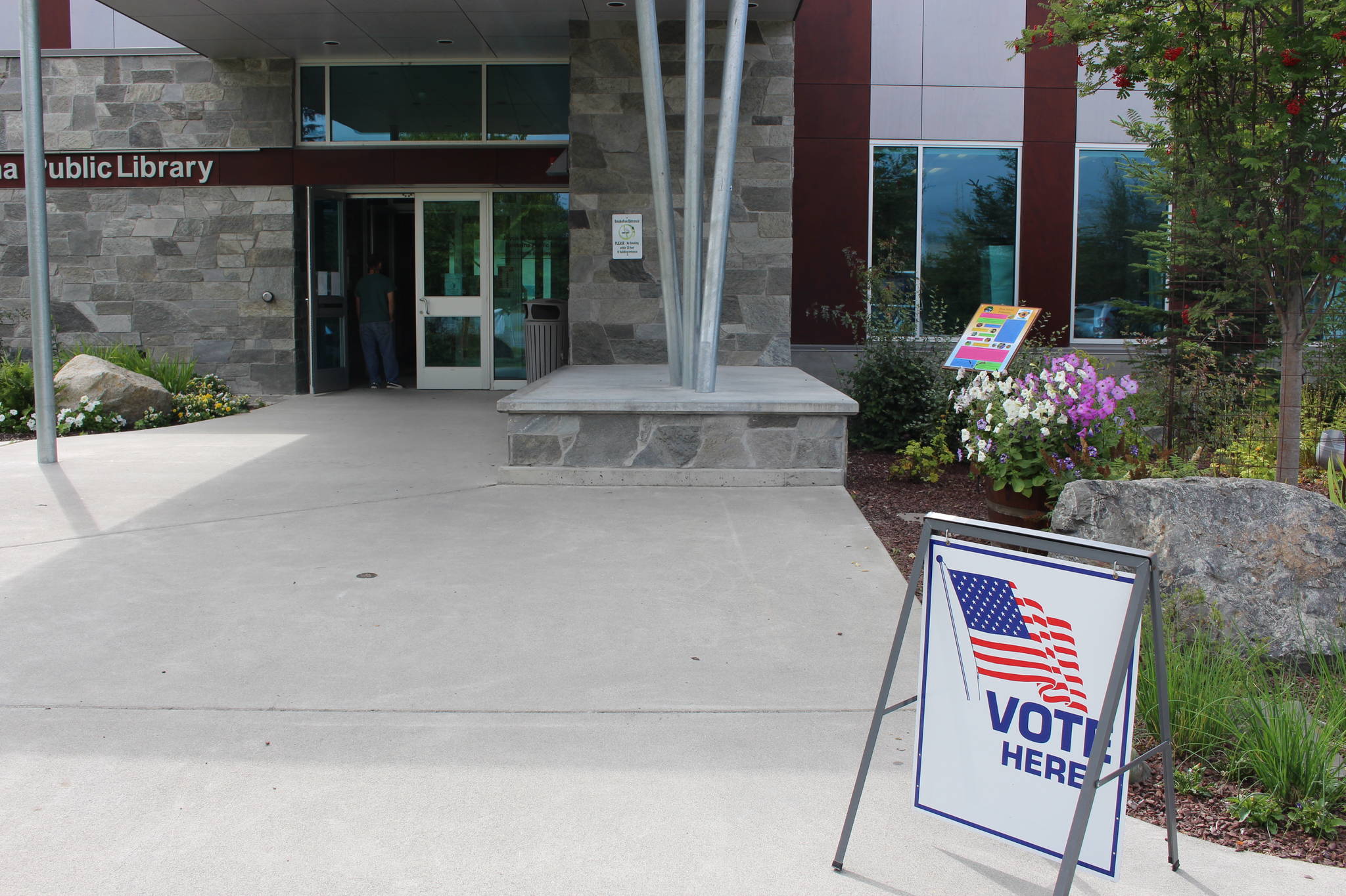 Soldotna residents stand in line to vote at the Soldotna Public Library during the primary election on Aug. 18, 2020. (Photo by Brian Mazurek/Peninsula Clarion)