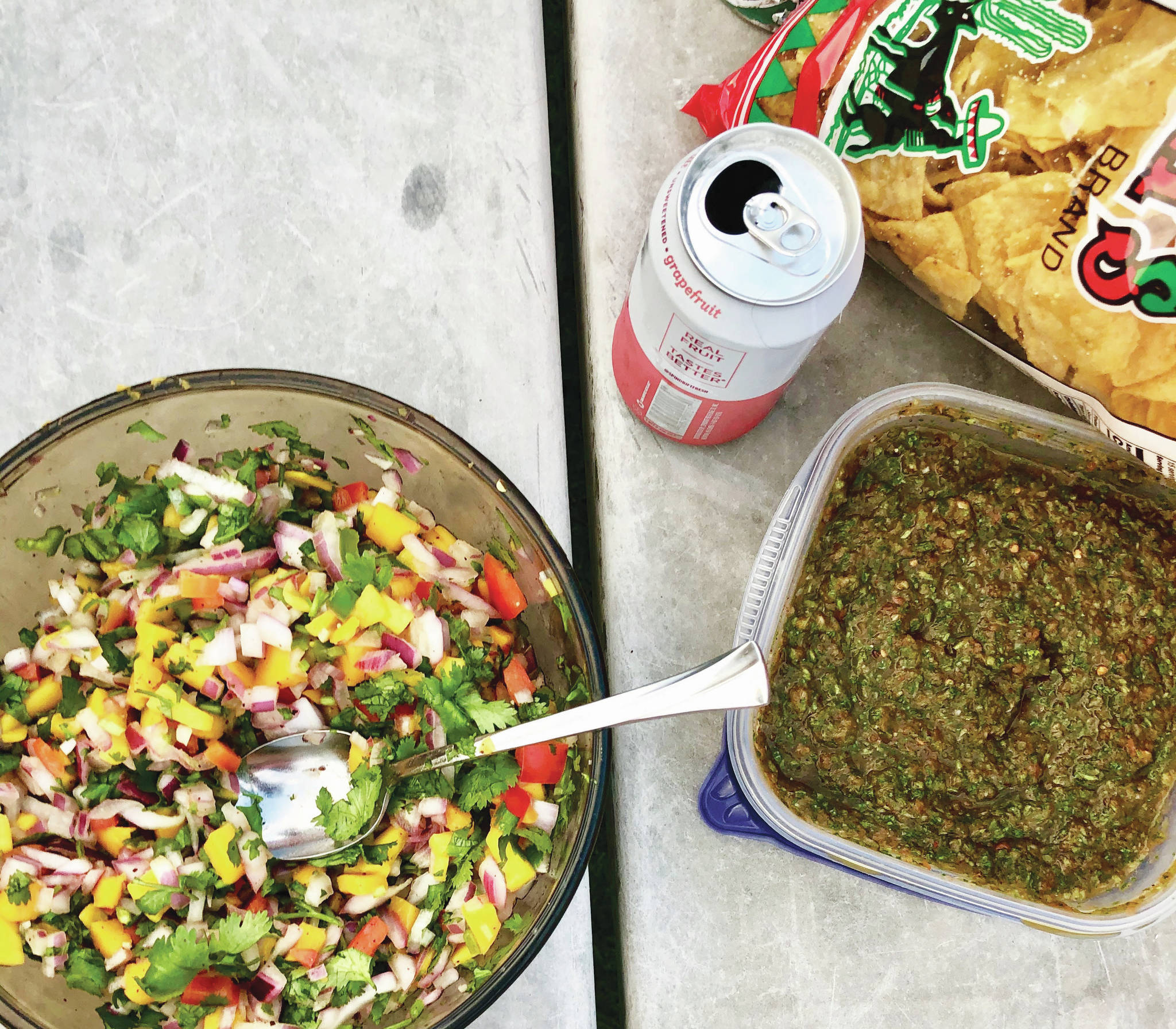 Victoria Petersen / Peninsula Clarion                                Bowls of mango salsa (left) and salsa verde are accompanied by seltzer water and tortilla chips as part of a shrimp tacos birthday meal.