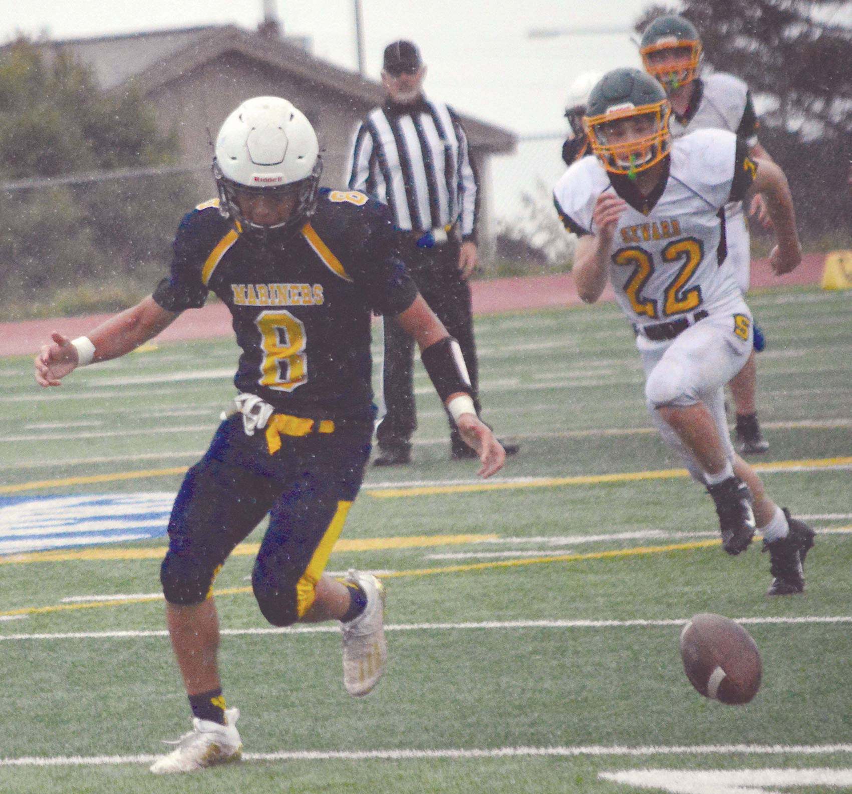 Mariners player Sly Ganoa goes for a fumble in a game at Homer, Alaska, on Aug. 29, 2020. (Photo by Michael Armstrong/Homer News)