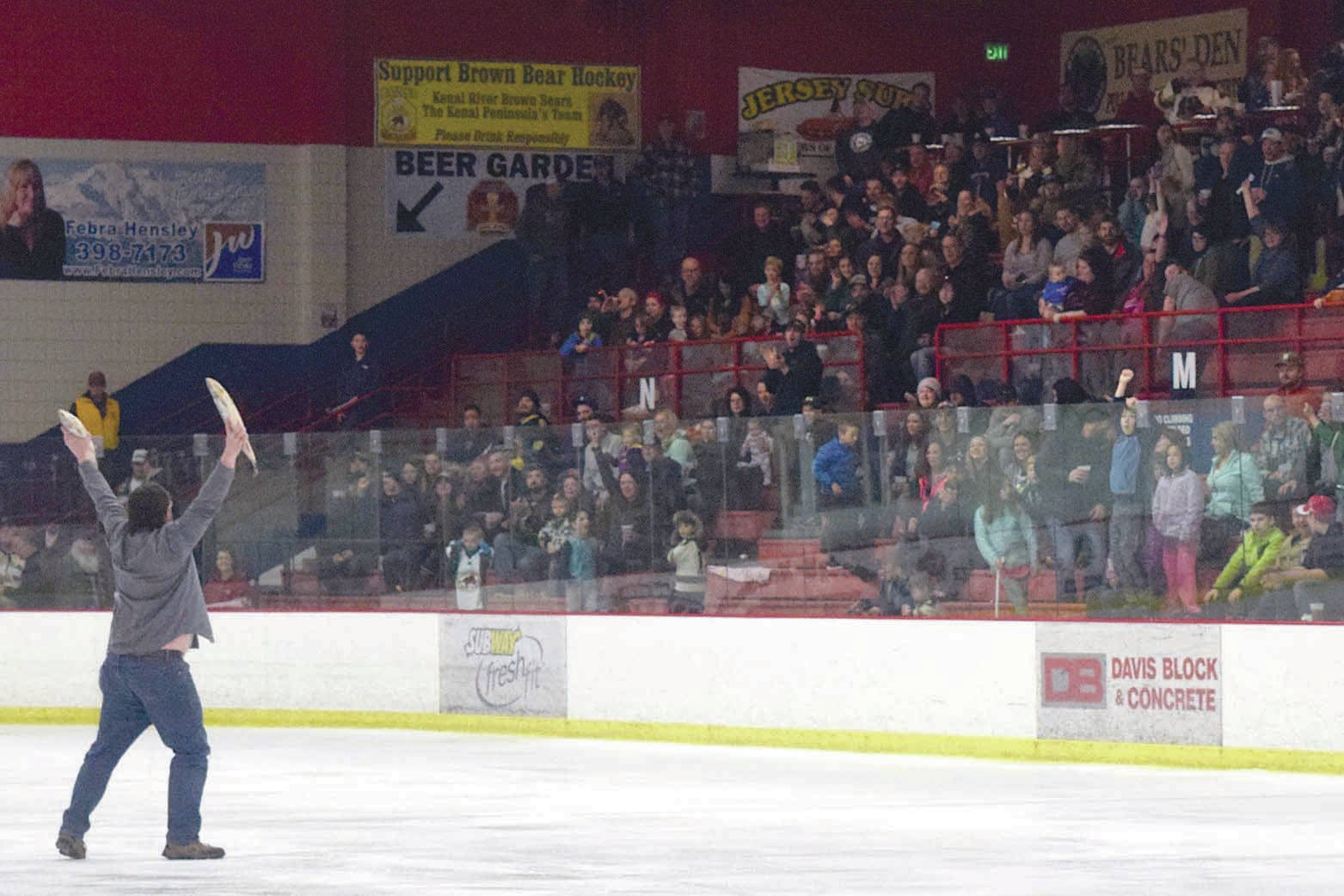 Brown Bears fans celebrate Luke Radetic’s goal in the third period by throwing the customary fish on the ice Friday, March 24, 2017, at the Soldotna Regional Sports Complex. (Photo by Jeff Helminiak/Peninsula Clarion)