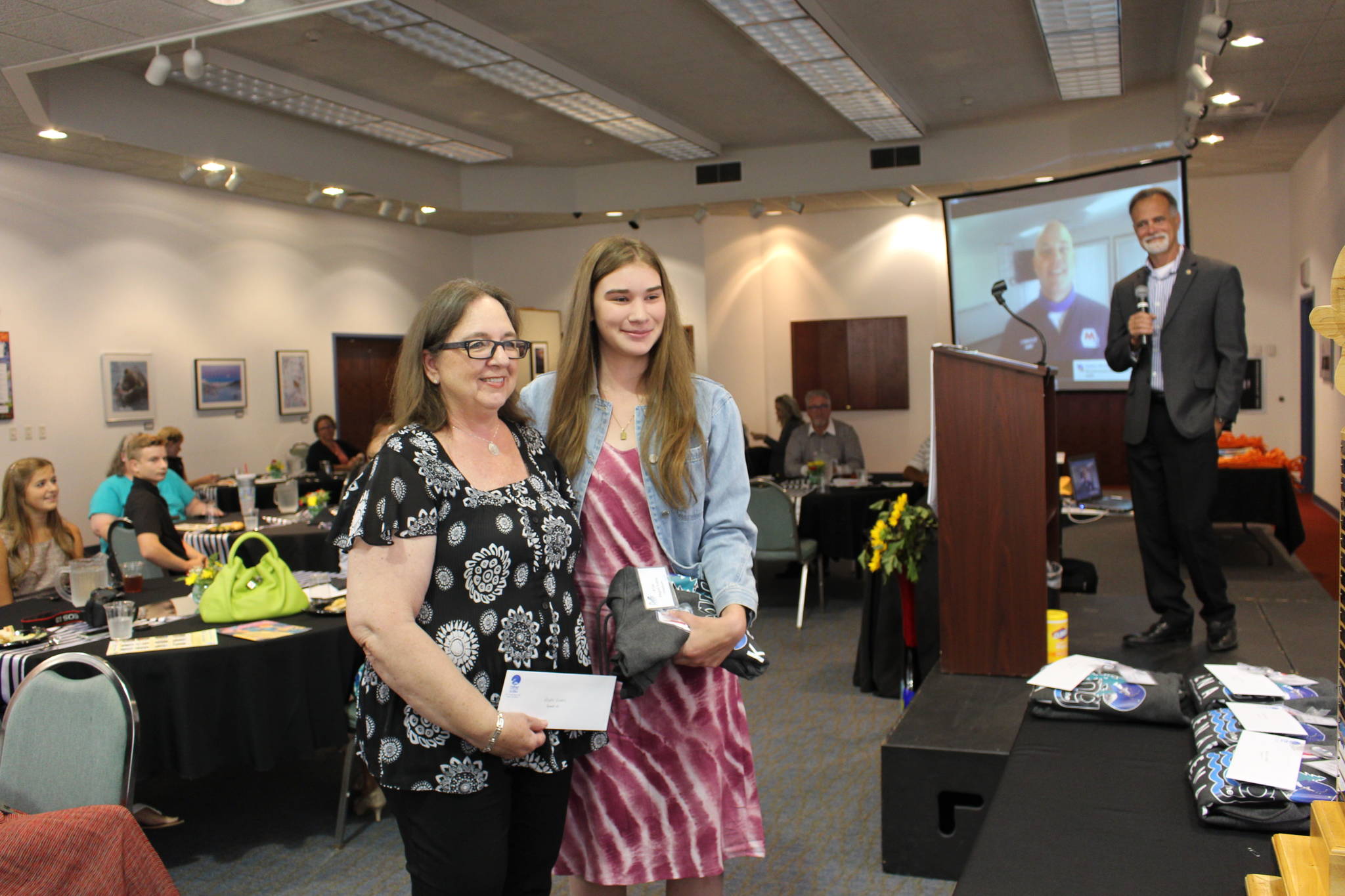 Leslie Rohr, left, and Regan Evans, right, attend the Caring for the Kenai Awards Luncheon at the Kenai Visitor and Cultural Center on Aug. 19, 2020. Evans’ project with Caring for the Kenai was the catalyst for the recent collaboration between Rohr — who is the executive director of Love, INC. — and Marnie Alcott, CEO of the Challenger Learning Center. (Photo by Brian Mazurek/Peninsula Clarion)