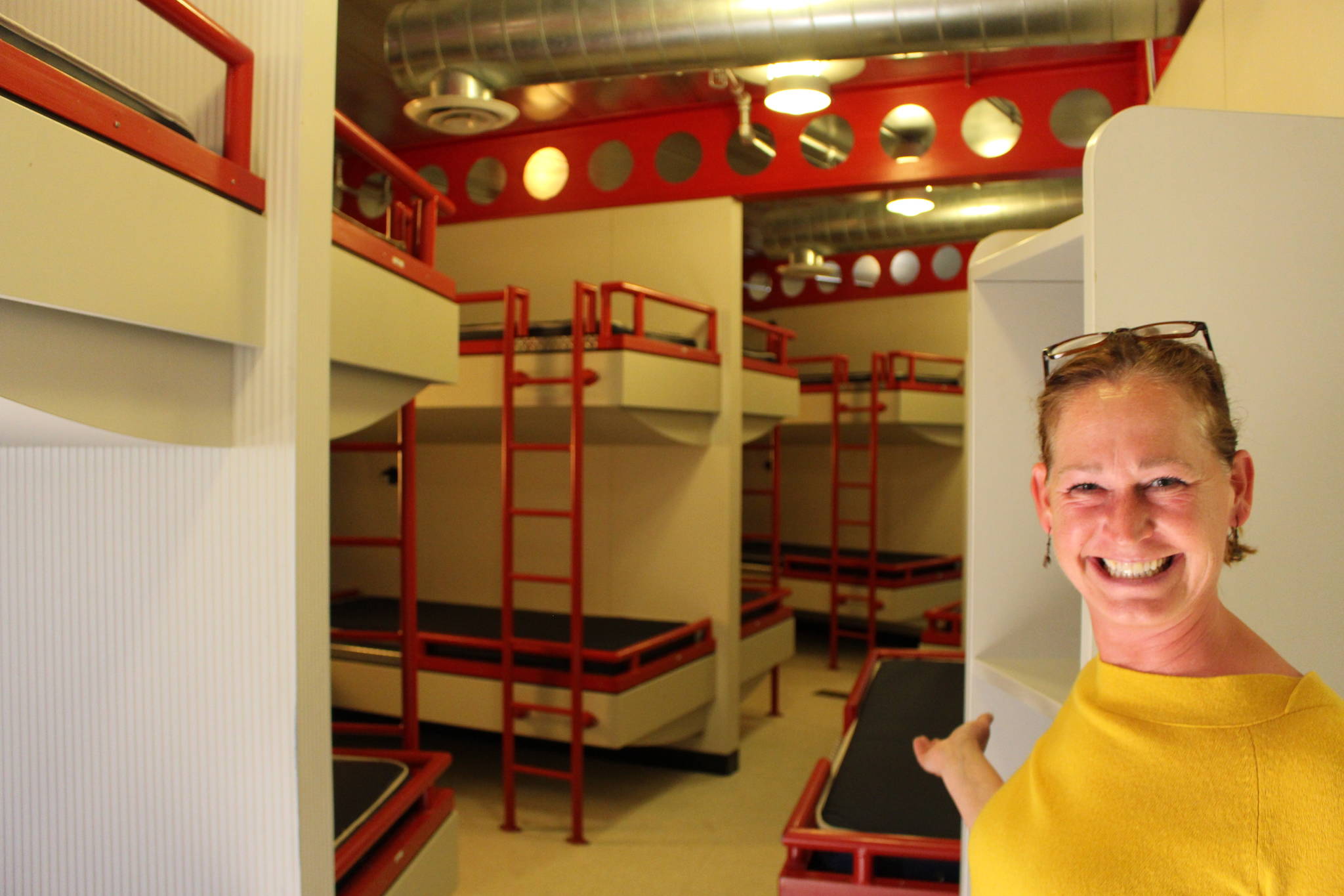 Marnie Alcott, the CEO of the Challenger Learning Center in Kenai, Alaska, shows one of the dormitories at the center that could be used as an emergency cold weather shelter this winter on Sept. 10, 2020. (Photo by Brian Mazurek/Peninsula Clarion)