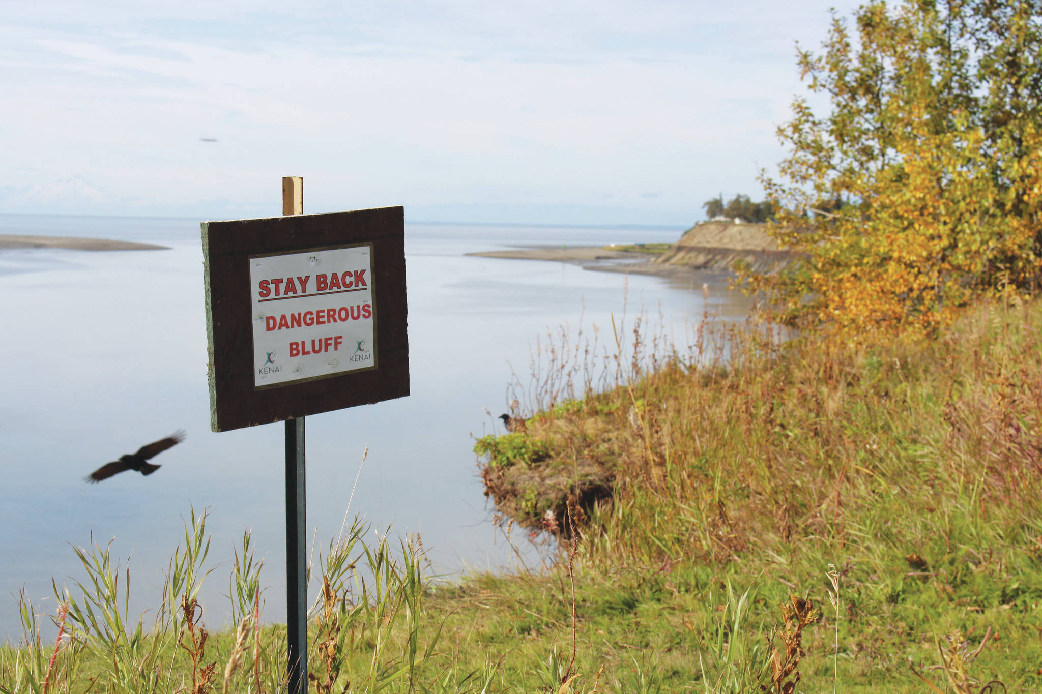 A sign warning residents of of bluff erosion is seen at the end of Spur View Drive in Kenai, Alaska, on Sept. 14, 2020. (Photo by Brian Mazurek/Peninsula Clarion)