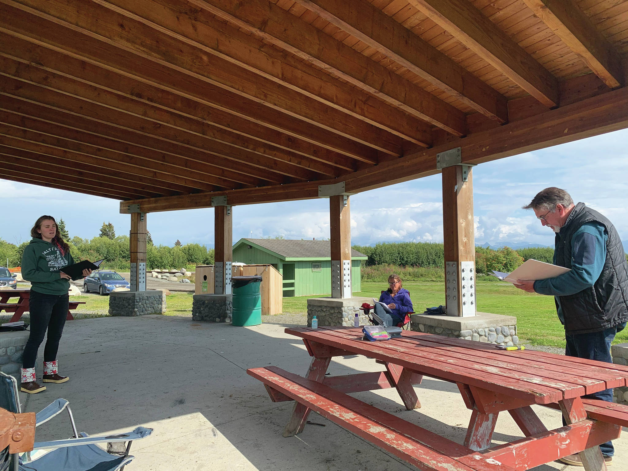 Some of the cast aof “Knife Skills” rehearse at Karen Hornaday Park in August in Homer, Alaska. From left to right are Helen-Thea Marcus, Ingrid Harrald and Darrel Oliver. (Photo courtesy of Lindsey Schneider)