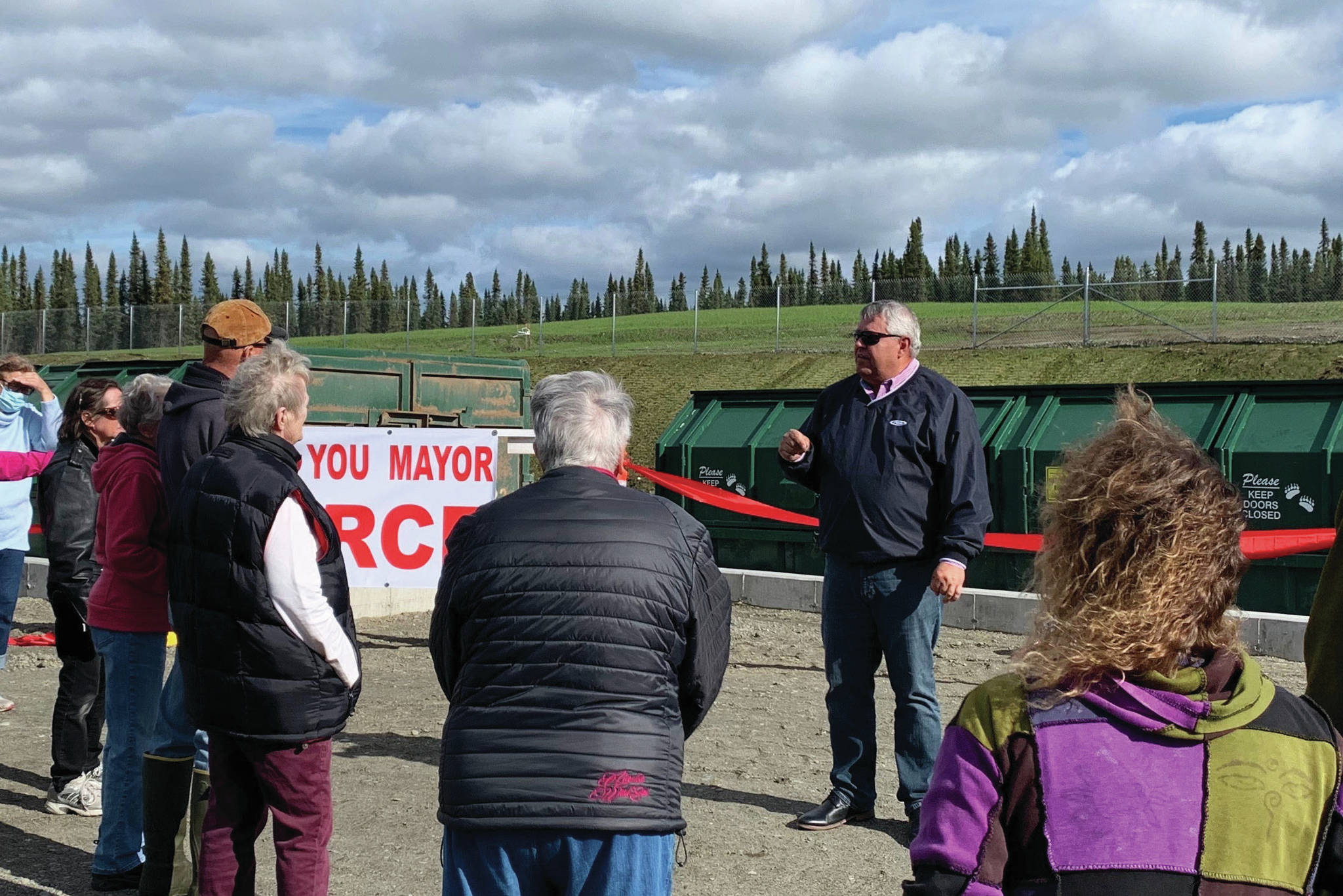 Ashlyn O’Hara/Peninsula Clarion                                Kenai Peninsula Borough Mayor Charlie Pierce addresses patrons at the Funny River Solid Waste Transfer Site on Friday. More than $670,000 in improvements are being made to the site.