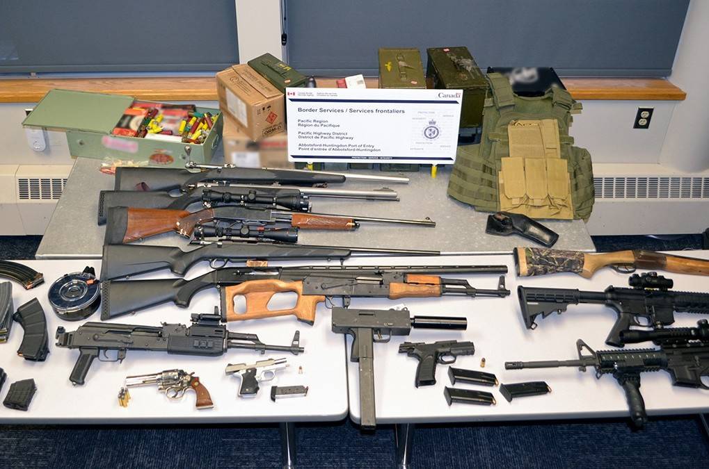 Courtesy photo / Canada Border Services Agency                                 An Alaska man will appear in Canadian court on Monday after border security officers seized the 14 firearms, pictured above, alongside loaded magazines, ammunition, and other paraphernalia, at a crossing southeast of Vancouver.