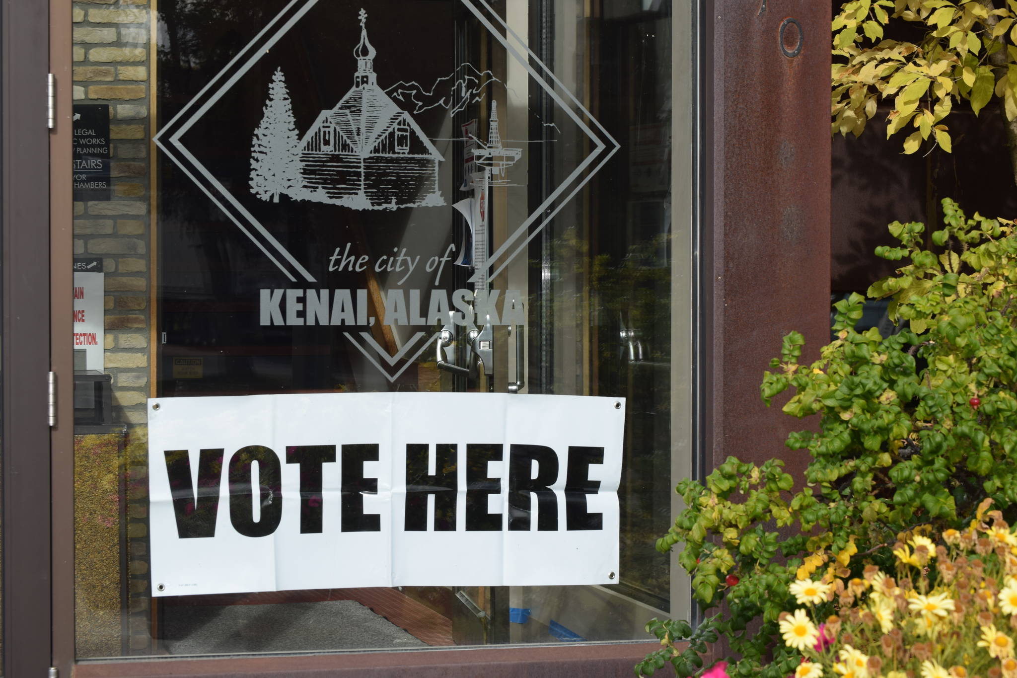 A “Vote Here” sign is seen at the City of Kenai building on Monday, Sept. 21, in Kenai.