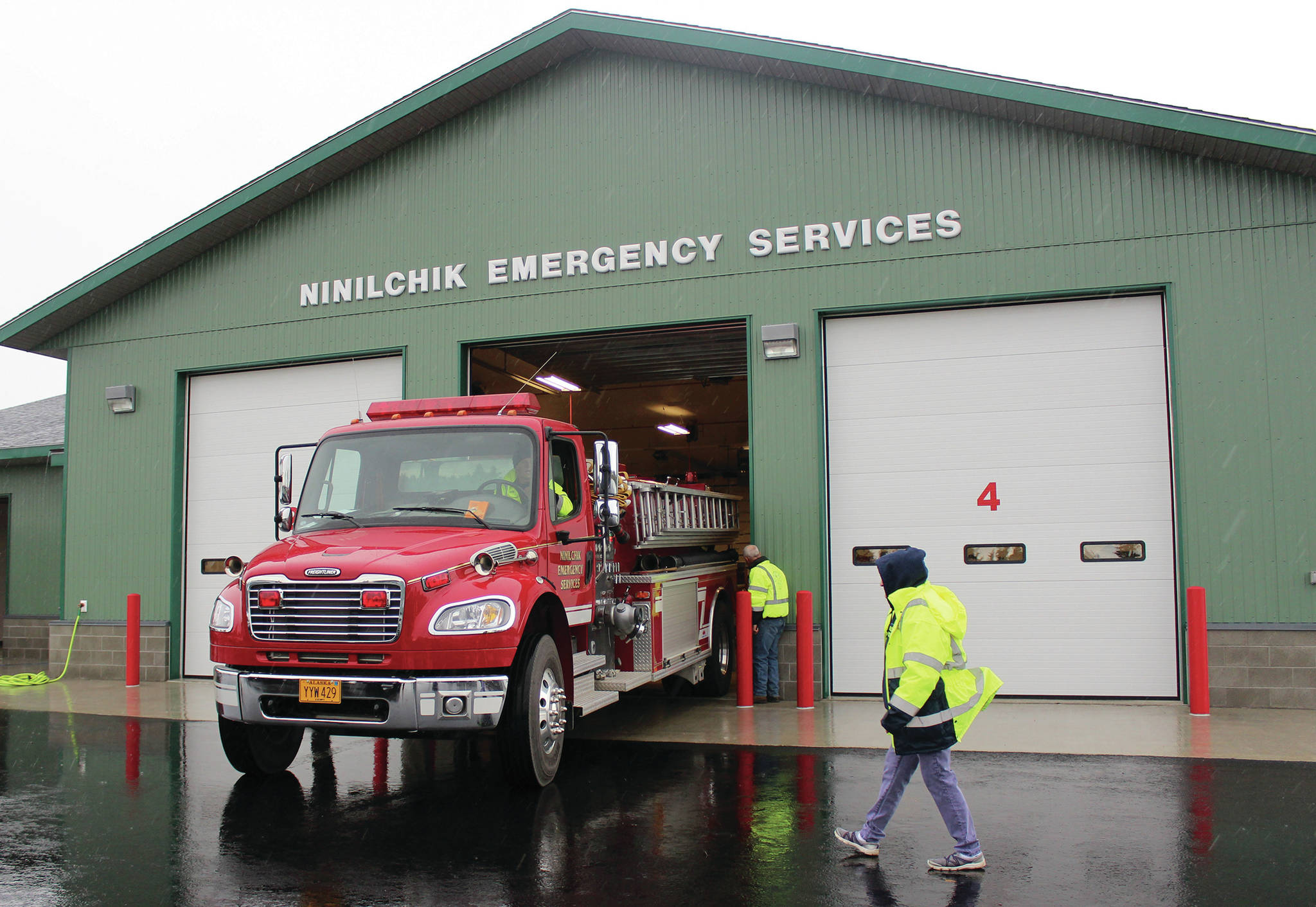 Ninilchik Fire Chief David Bear moves the fire truck out of the new Ninilchik Emergency Services building on Aug. 9, 2014, to make room for visitors to the open house of the new NES building. (Homer News file photo)