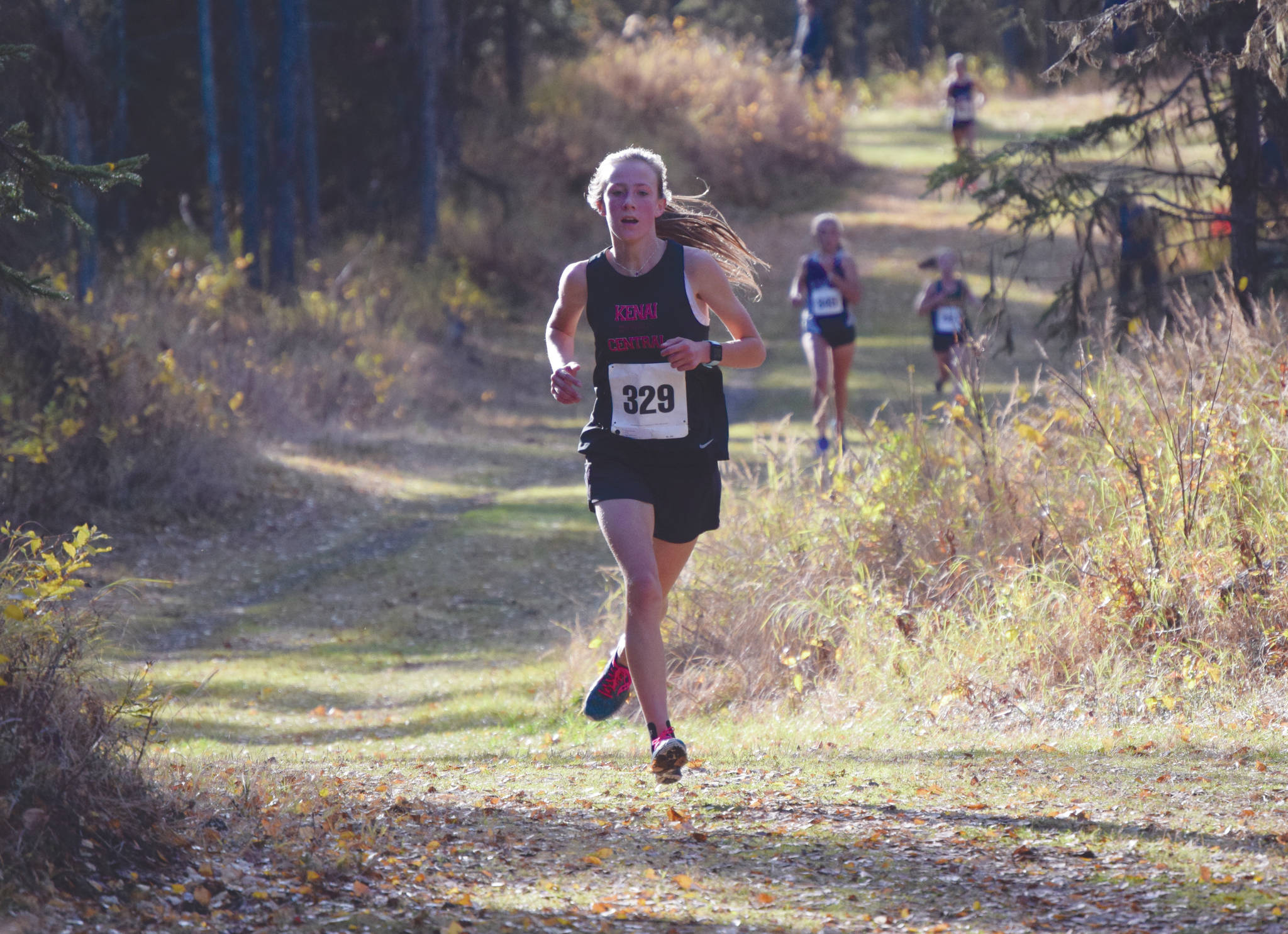 Kenai Central’s Jayna Boonstra runs to victory at the Region III/Southern Division meet Saturday, Oct. 3, 2020, at Tsalteshi Trails near Soldotna, Alaska. (Photo by Jeff Helminiak/Peninsula Clarion)