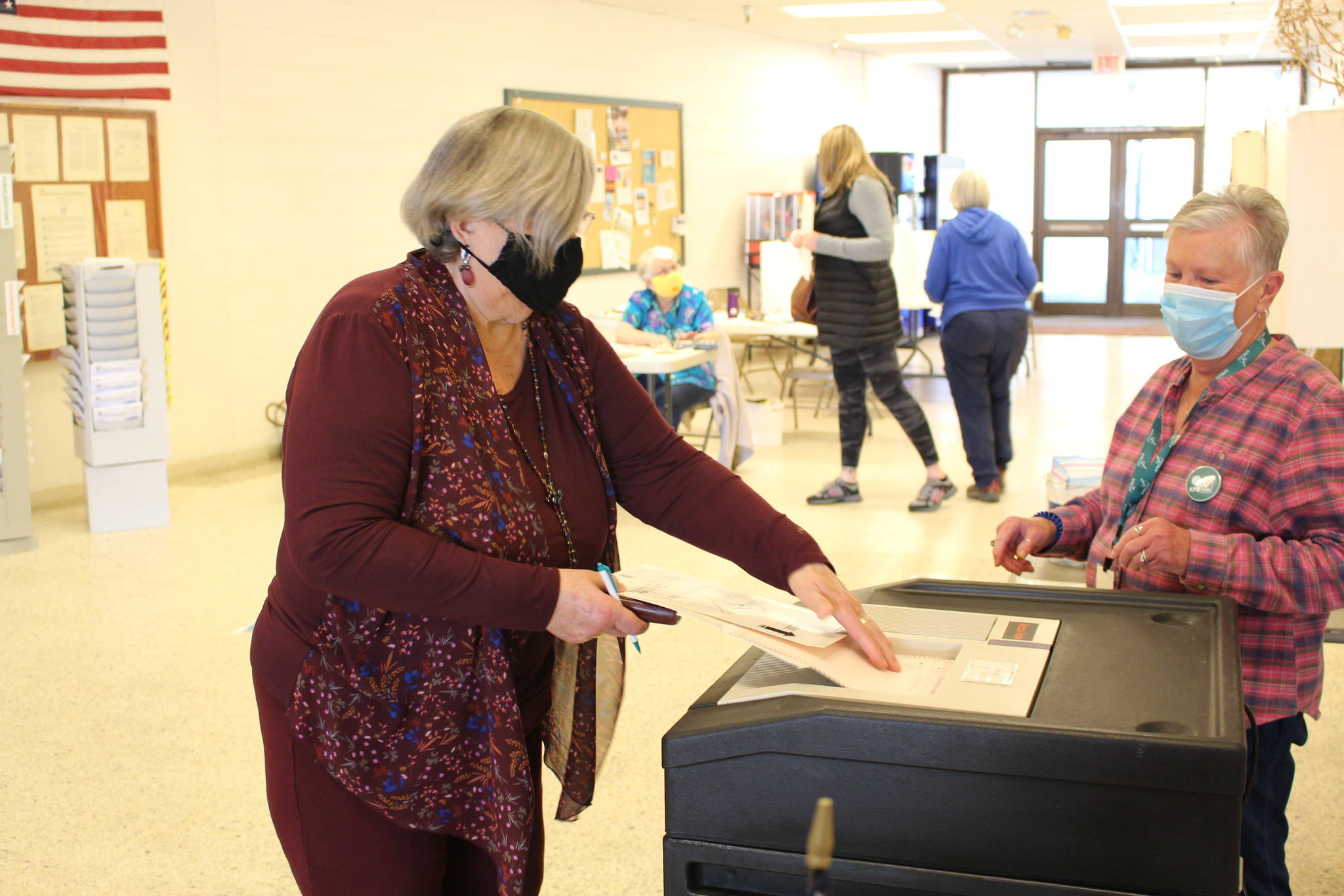 Marcia Heinrich casts her ballot for the municipal elections in Kenai, Alaska on Oct. 6, 2020. (Photo by Brian Mazurek/Peninsula Clarion)