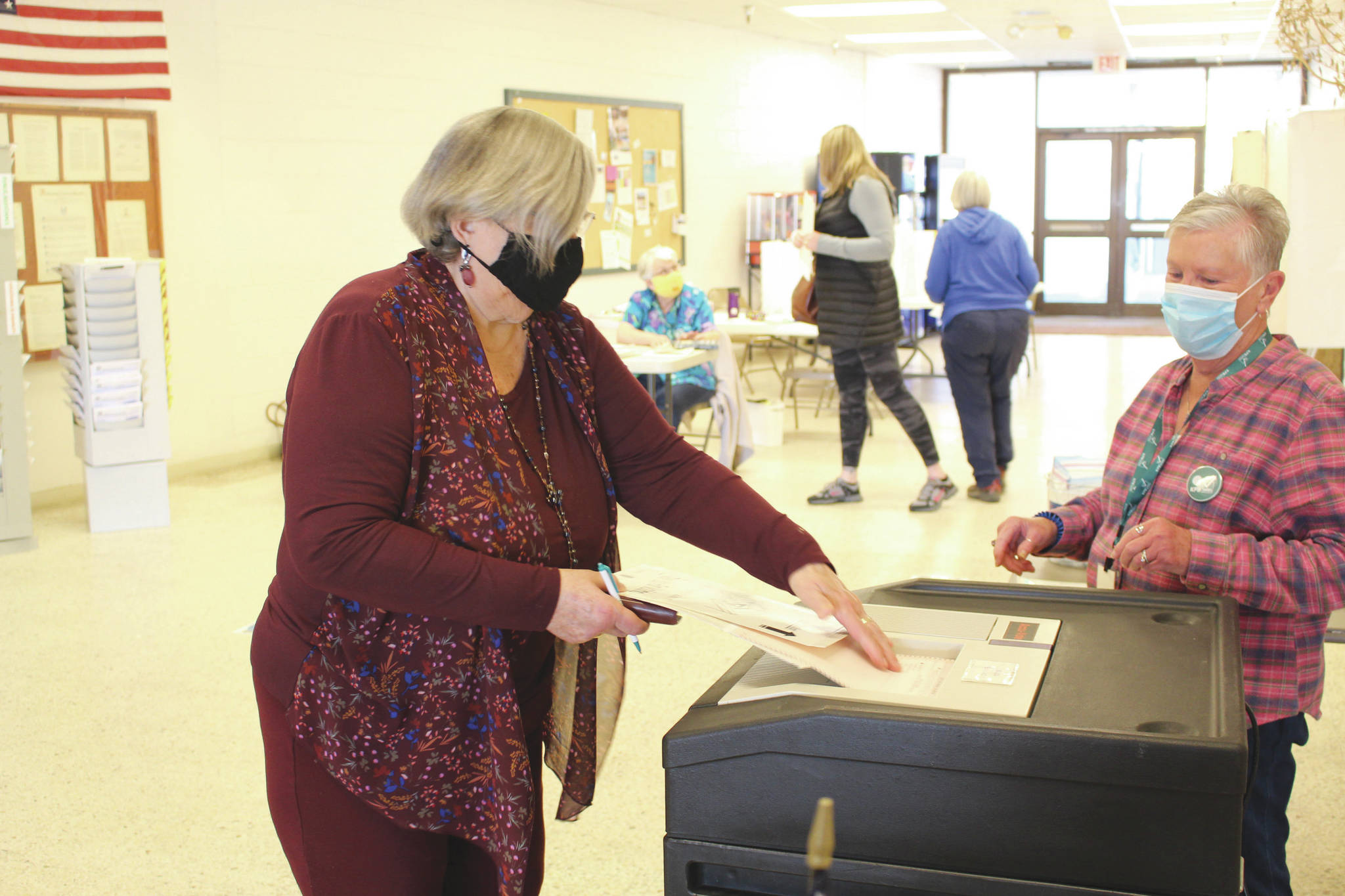 Brian Mazurek/Peninsula ClarionMarcia Heinrich casts her ballot for the municipal elections in Kenai on Tuesday.