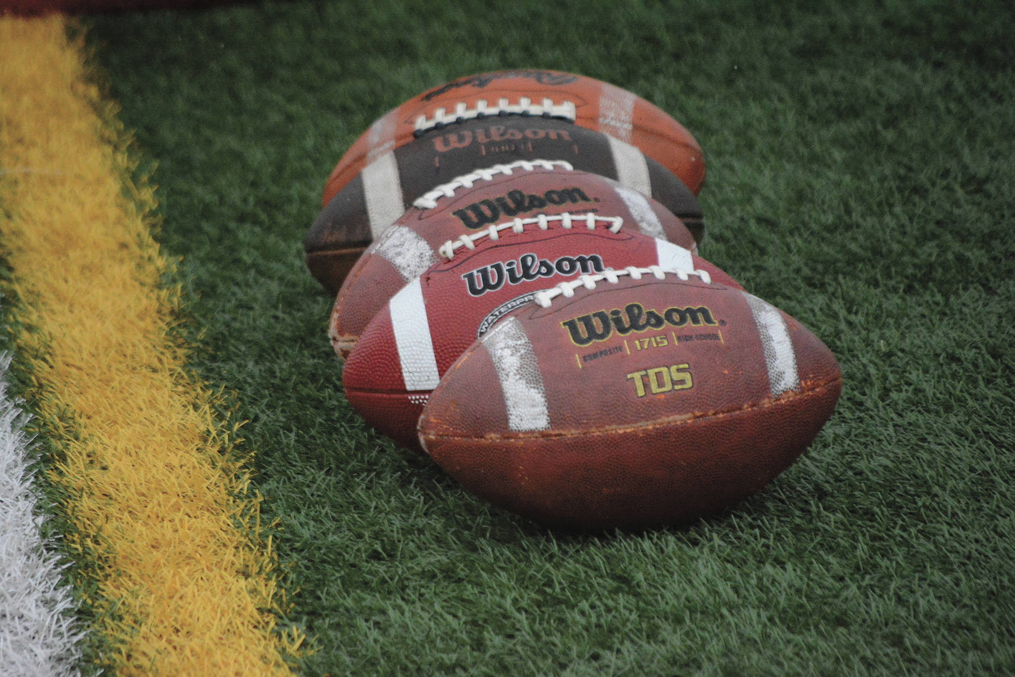 A row of footballs at the Homer-Seward game at Homer, Alaska, on Aug. 29, 2020. (Photo by Michael Armstrong/Homer News)