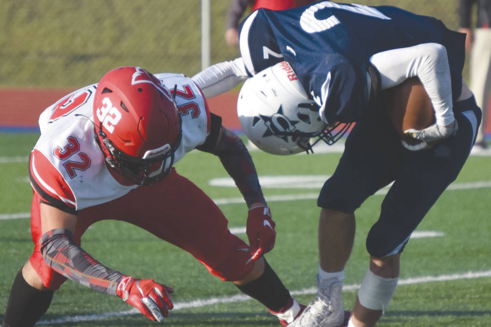 Soldotna's Josh Heiber escapes the tackle of Kenai Central's Tucker Vann on Friday, Oct. 9, 2020, at Justin Maile Field at Soldotna HIgh School. Heiber would run to the end zone on the play, but the score would not stand due to a penalty. (Photo by Jeff Helminiak/Peninsula Clarion)