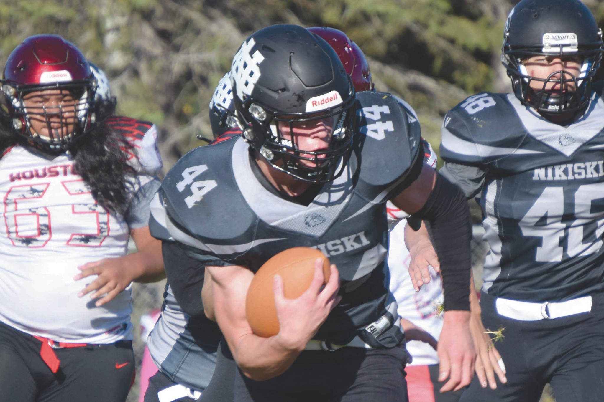 Nikiski's Koleman McCaughey rushes against Houston on Saturday, Oct. 10, 2020, at Nikiski High School in Nikiski, Alaska. (Photo by Jeff Helminiak/Peninsula Clarion)