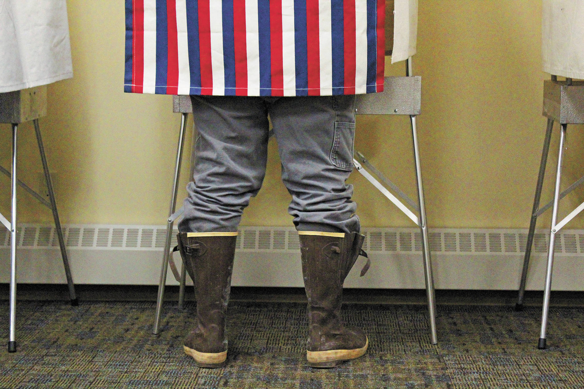 A Homer resident casts their vote during the Primary Election on Tuesday, Aug. 18 at Homer City Hall.(Photo by Megan Pacer/Homer News)