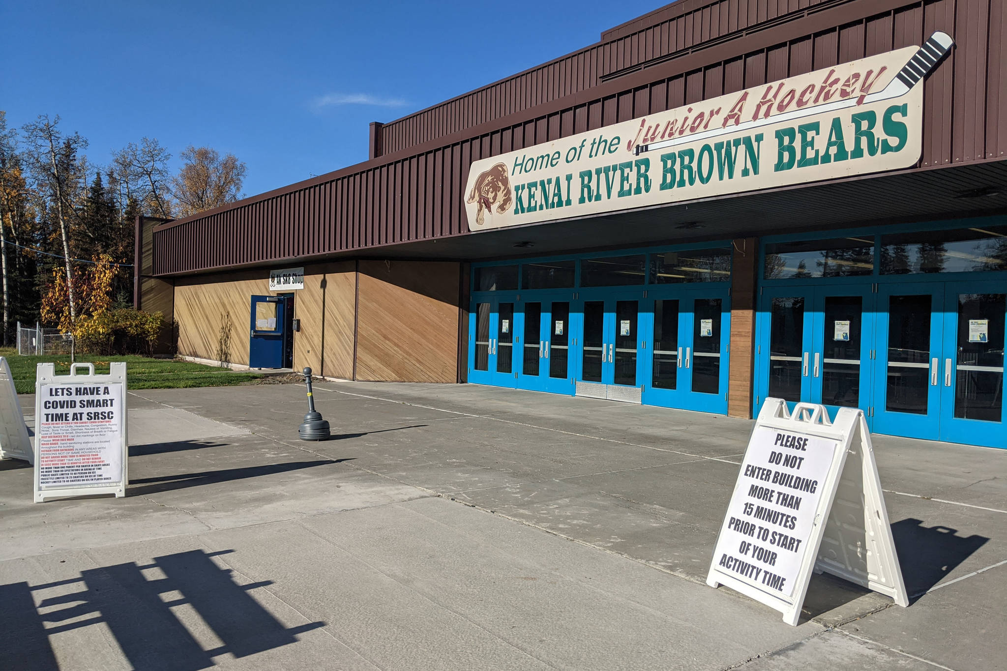 Signs advertising COVID-19 safety protocoals stand outside the Soldotna Regional Sports Complex on Oct. 6, 2020, in Soldotna, Alaska. (Photo by Erin Thompson/Peninsula Clarion)