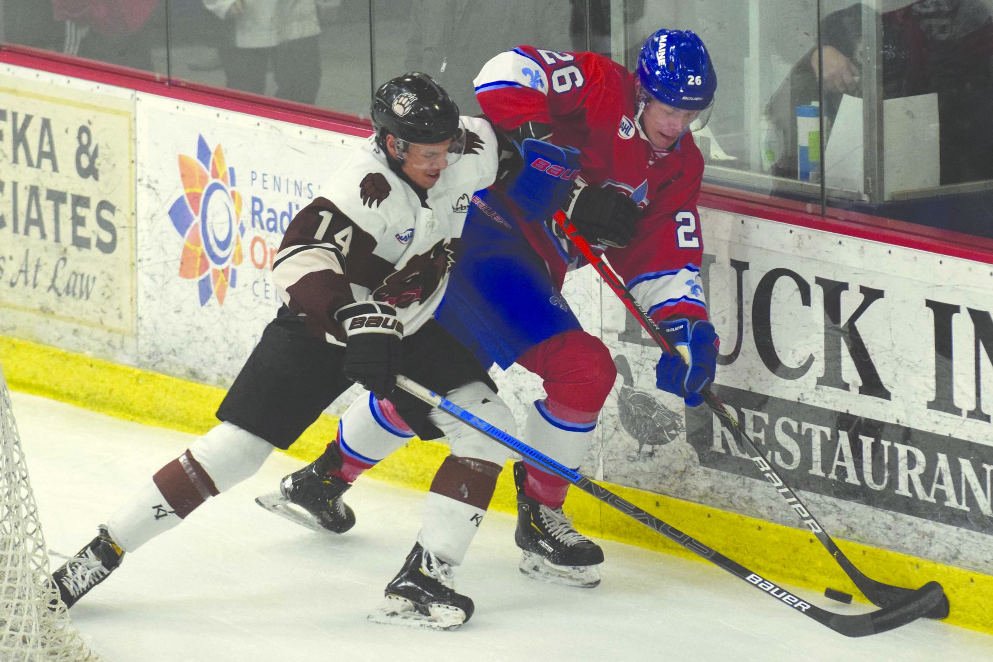 Kenai River Brown Bears defenseman Ryan Reid battles Ignat Belov of the Maine Nordiques for the puck Friday, Jan. 17, 2020, at the Soldotna Regional Sports Complex in Soldotna, Alaska. (Photo by Jeff Helminiak/Peninsula Clarion)