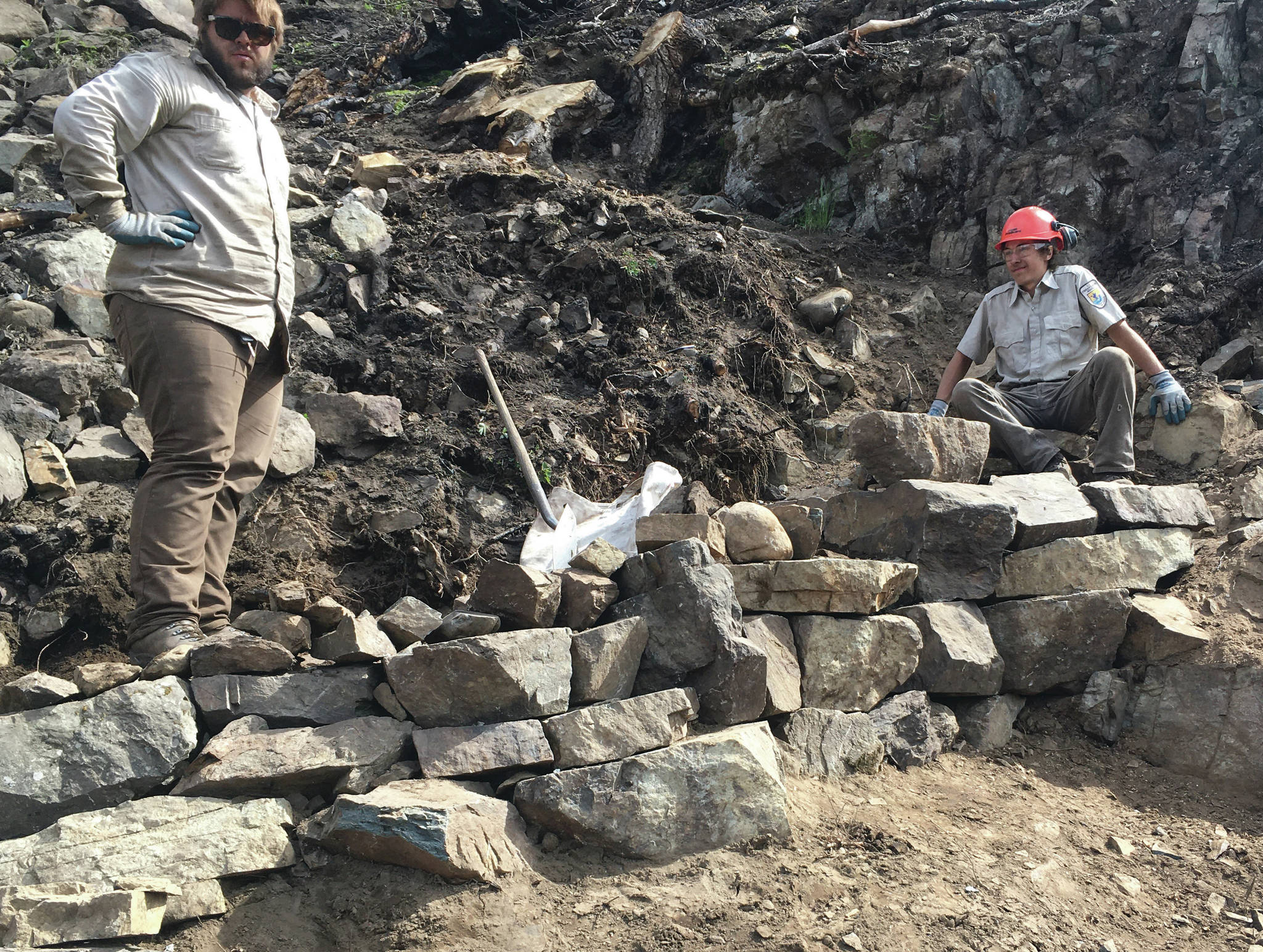 Kasey Renfro and Seth Payment show off their tier rock wall on Skyline Trail. (Photo provided by Kenai National Wildlife Refuge)