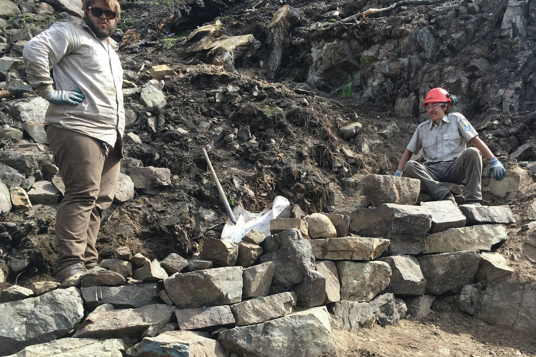 Kasey Renfro and Seth Payment show off their tier rock wall on Skyline Trail. (Photo provided by Kenai National Wildlife Refuge)