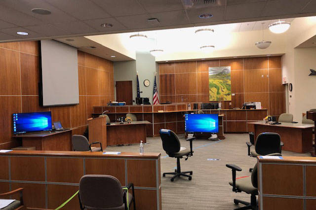Social distancing measures, including TVs for exhibits and marked spaces on the floor, taken to address the coronavirus pandemic are shown inside a courtroom at the Kenai Courthouse in this October 2020 photo. (Photo courtesy Judge Jennifer Wells)