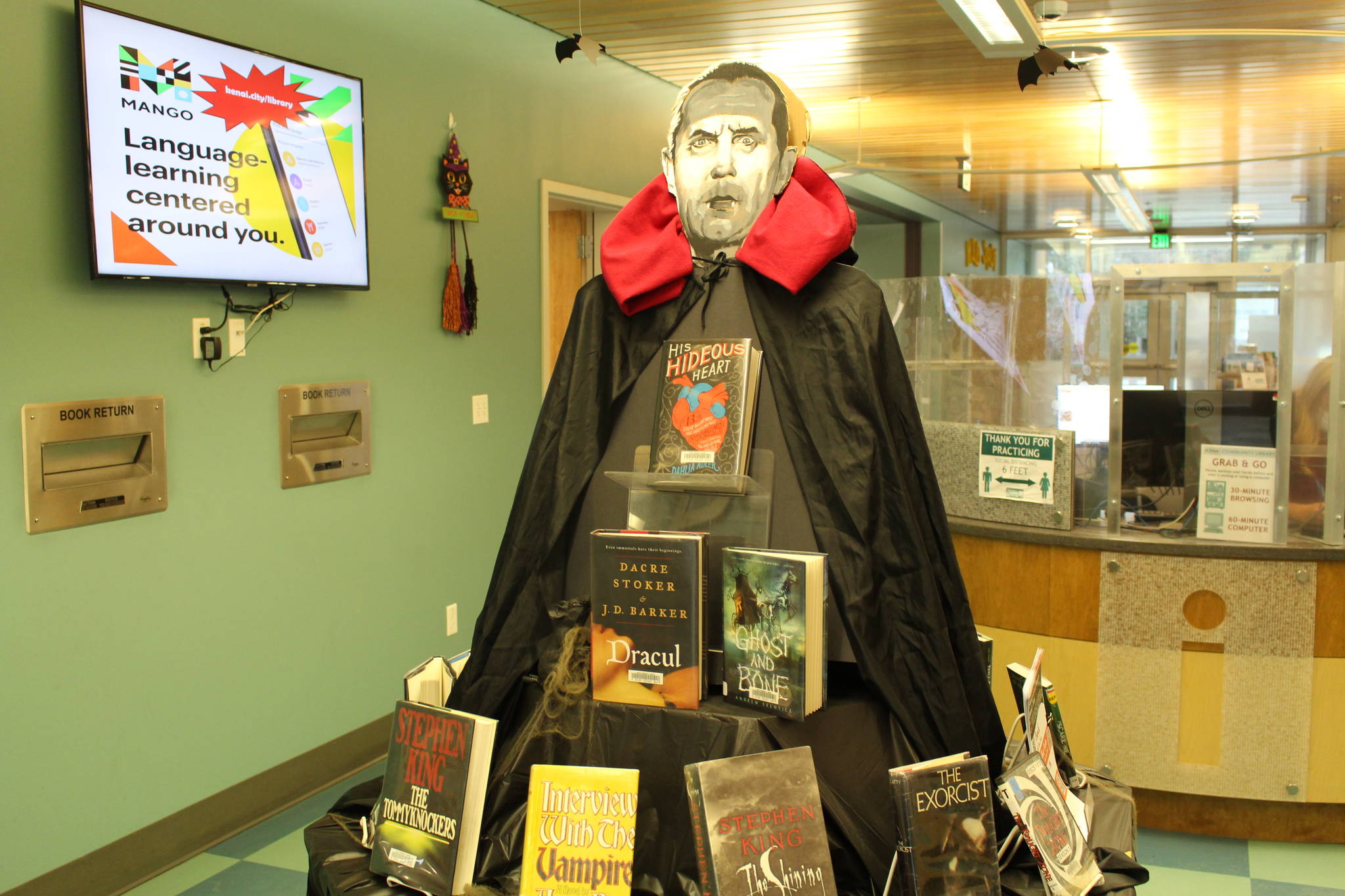 Halloween and horror-themed books are seen on display at the Kenai Community Library on Oct. 24, 2020. (Photo by Brian Mazurek/Peninsula Clarion)