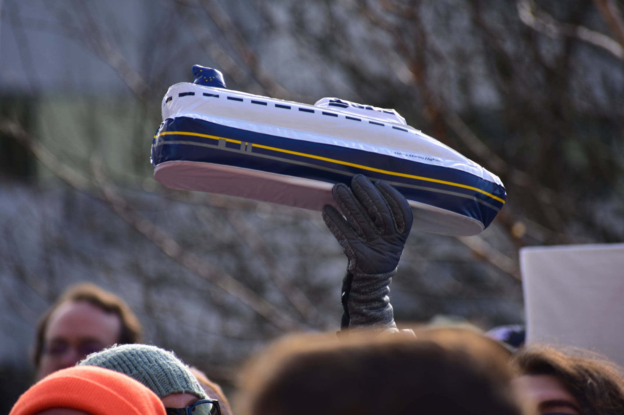 Peter Segall / Juneau Empire File Someone holds up an inflatable Alaska Marine Highway ferry at at a rally to support of the Alaska Marine Highway System on Tuesday, Feb. 11.