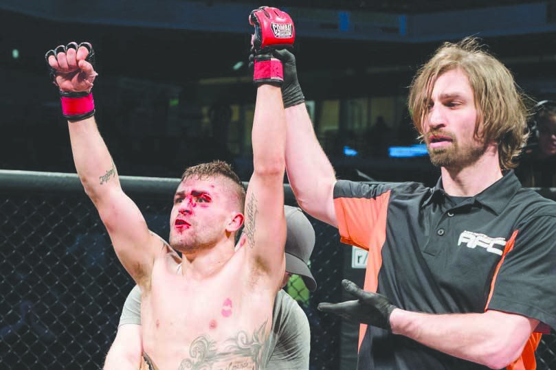 Victor Rodriguez is awarded the Alaska Fighting Championship bantamweight title on Feb. 26, 2020, at the Alaska Airlines Center in Anchorage, Alaska. (Photo courtesy of Maria Bundy)