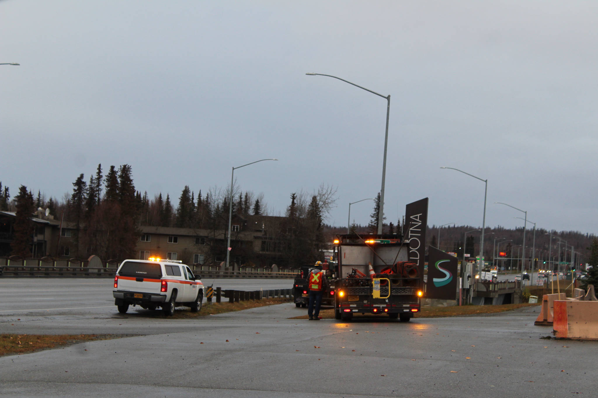 Crews work along the Sterling Highway over the Kenai River on Monday in Soldotna. (Photo by Ashlyn O’Hara/Peninsula Clarion)