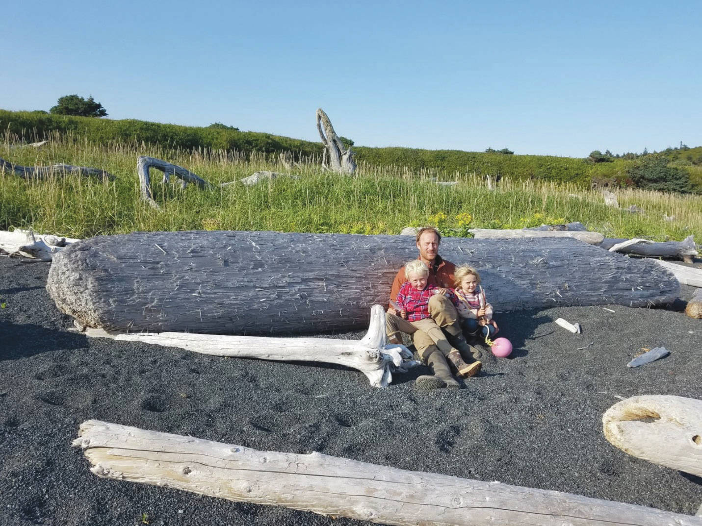 Eivin Kilcher with his children and their flotsam treasures on Ushagat Island in August 2020. (Photo by Eve Kilcher)