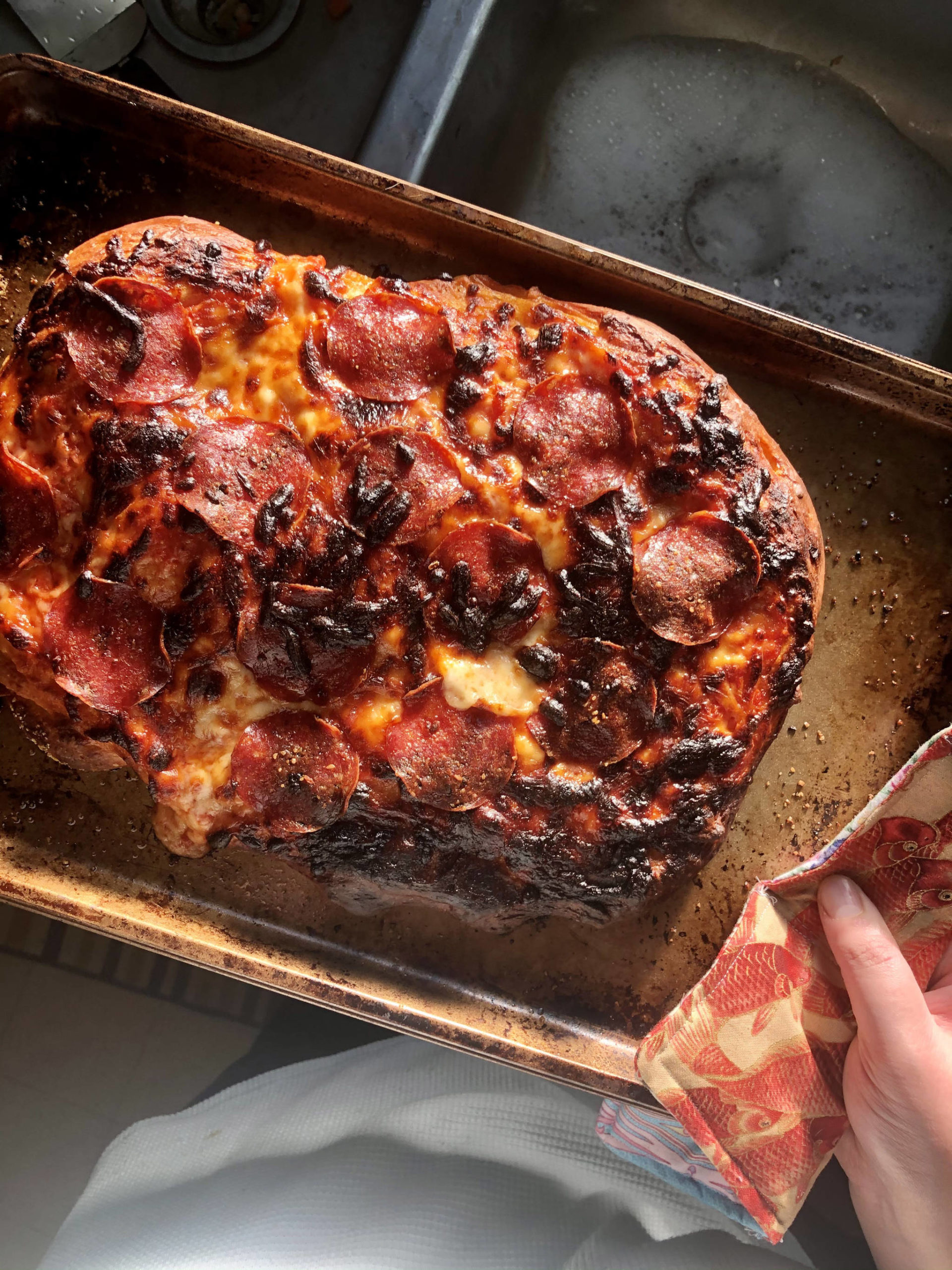 A little bit burnt, but this pizza turned out great, on Monday, Nov. 2, 2020, in Anchorage, Alaska. (Photo by Victoria Petersen/Peninsula Clarion).