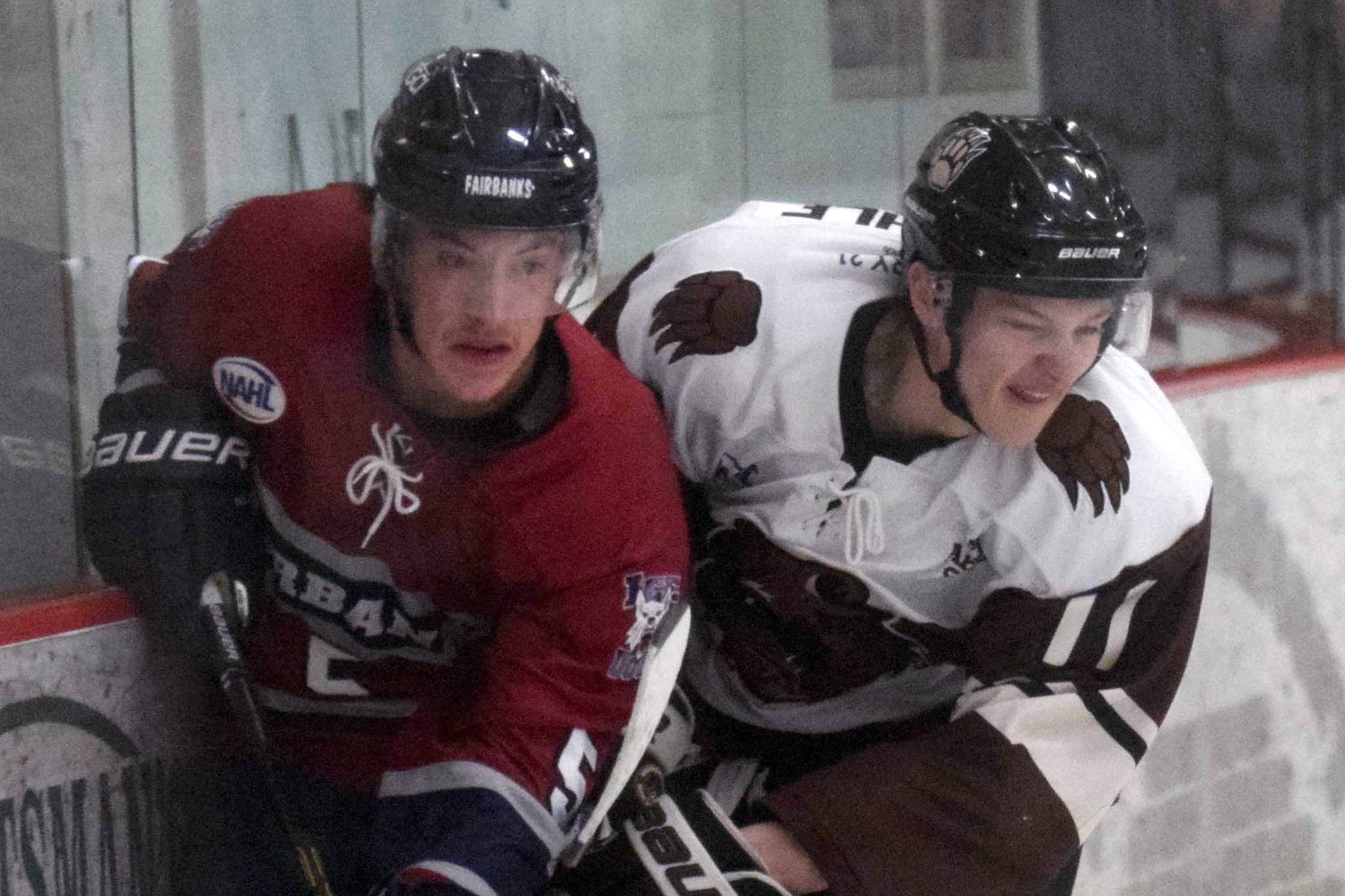 Fairbanks Ice Dogs defenseman Jasper Lester and Kenai River Brown Bears forward Porter Schachle battle along the boards Thursday, Nov. 21, 2019, at the Soldotna Regional Sports Complex in Soldotna, Alaska. (Photo by Jeff Helminiak/Peninsula Clarion)