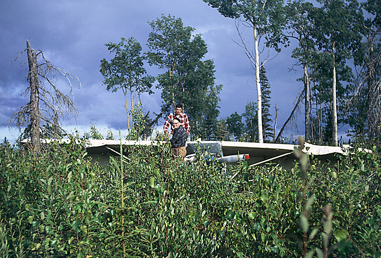 Friends of Elmer Gaede effect repairs to the doctor’s Maule Rocket airplane, which crashed a short distance from Forest Lane between Soldotna and Sterling on Aug. 2, 1967. The airplane was eventually made “fly-able” again and was sold in the early 1970s. (Photo courtesy of the Gaede Collection)