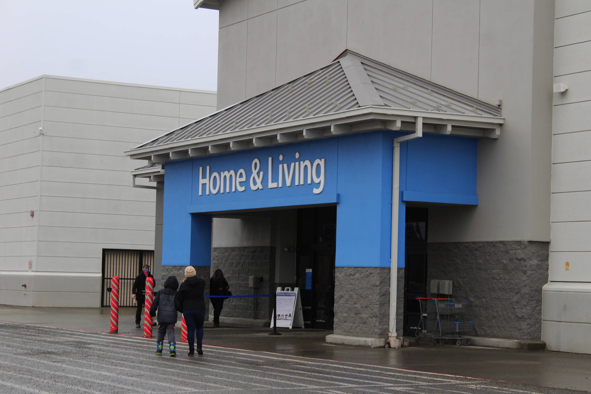 People are seen walking into Walmart on Wednesday, November 25 in Kenai, Alaska.
