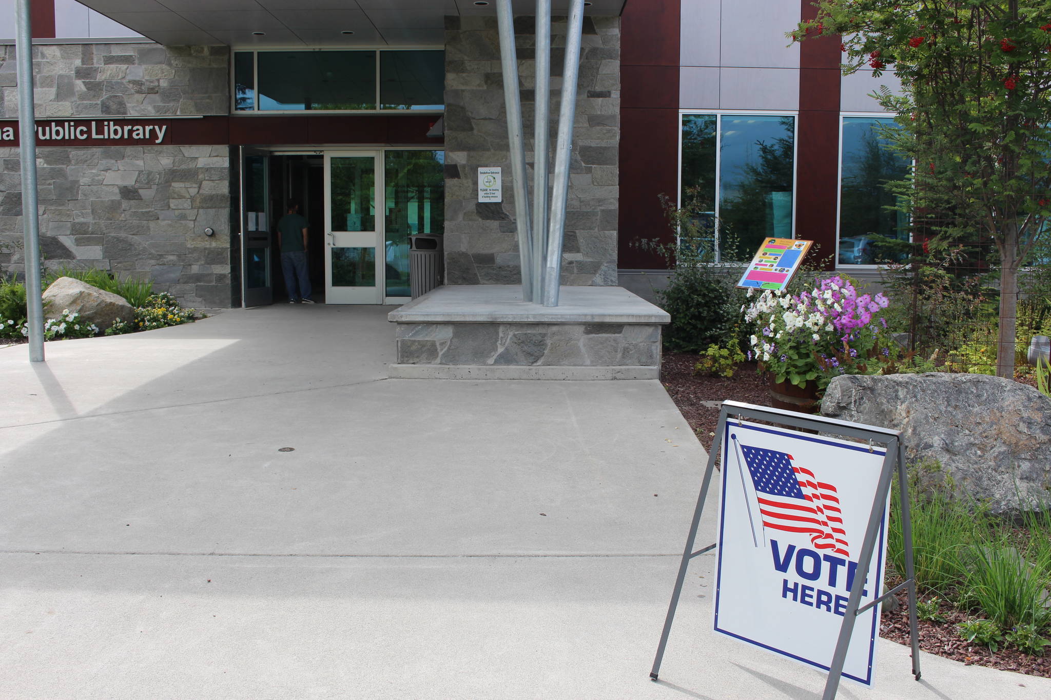 Soldotna residents stand in line to vote at the Soldotna Public Library during Primary Election Day on Aug. 18, 2020. (Photo by Brian Mazurek/Peninsula Clarion)