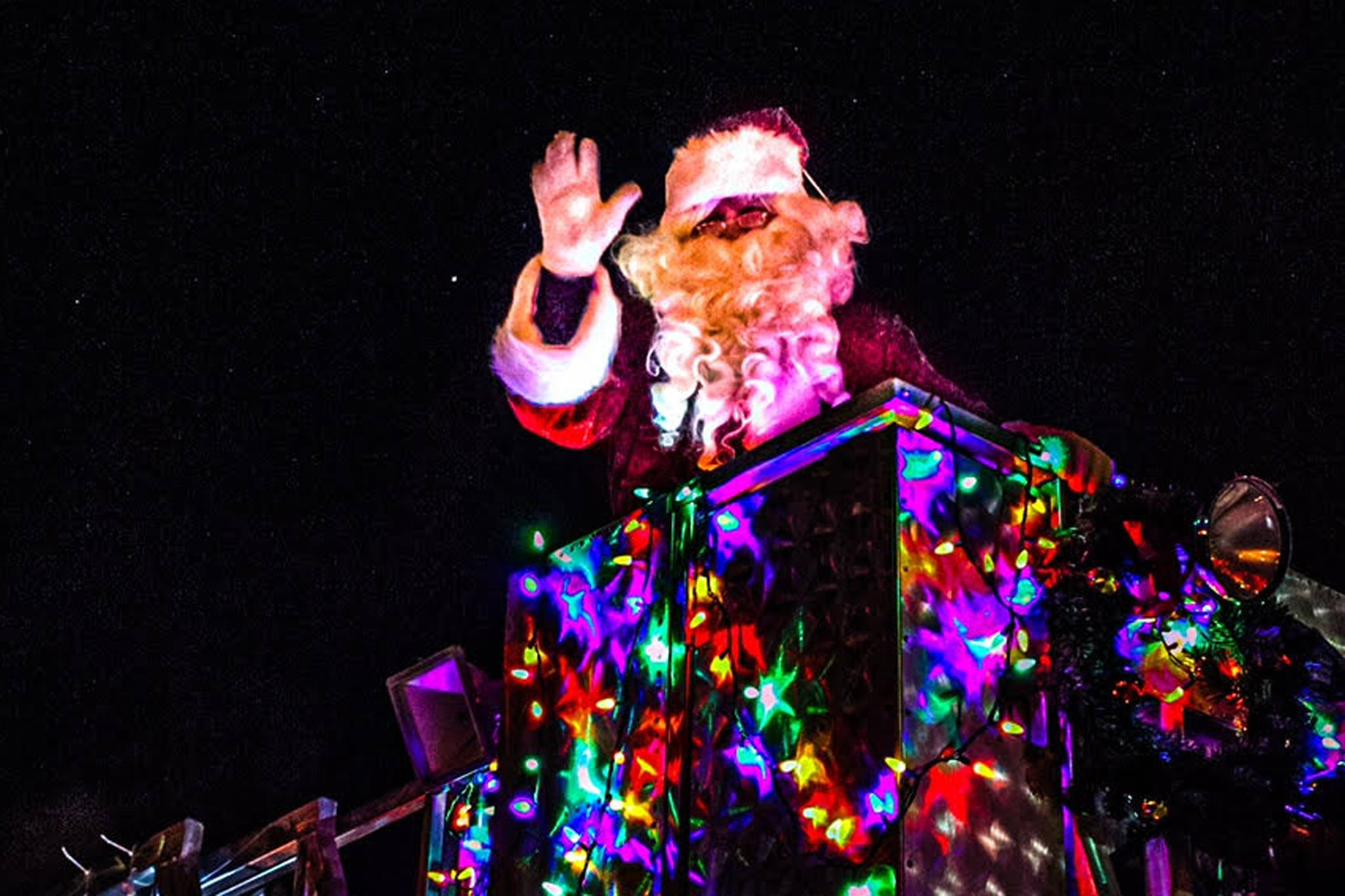 Santa Claus waves to the crowd atop a City of Kenai fire truck during the 2020 Christmas Comes to Kenai Parade in Kenai, Alaska on Nov. 27, 2020. (Photo courtesy Brittany Brown/Kenai Chamber of Commerce).