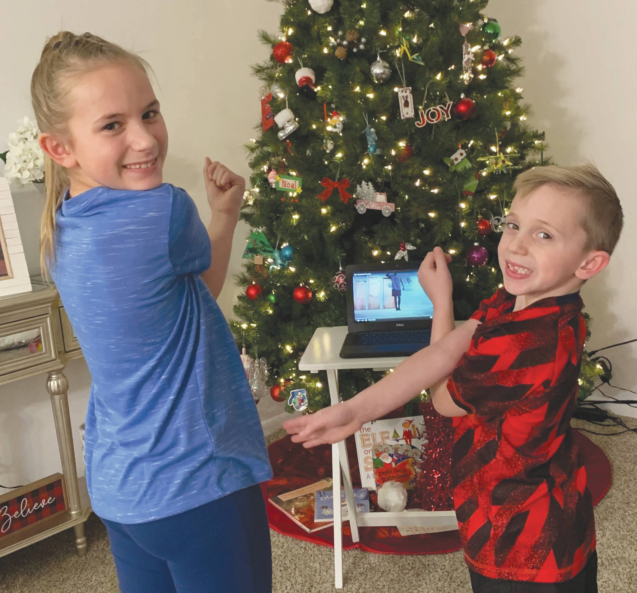 Photo provided by Megan Coleman 
Kaleidoscope School of Arts and Science students Brooklyn and Easton Coleman participate remotely in their home in the physical education class of Todd Boonstra on Tuesday.