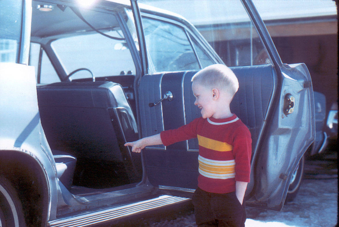 Four-year-old Lowell Fair indicates the backseat of the Fair family stationwagon during a 1972 photo-op set up by his father. (Photo courtesy of the Fair Family Collection)