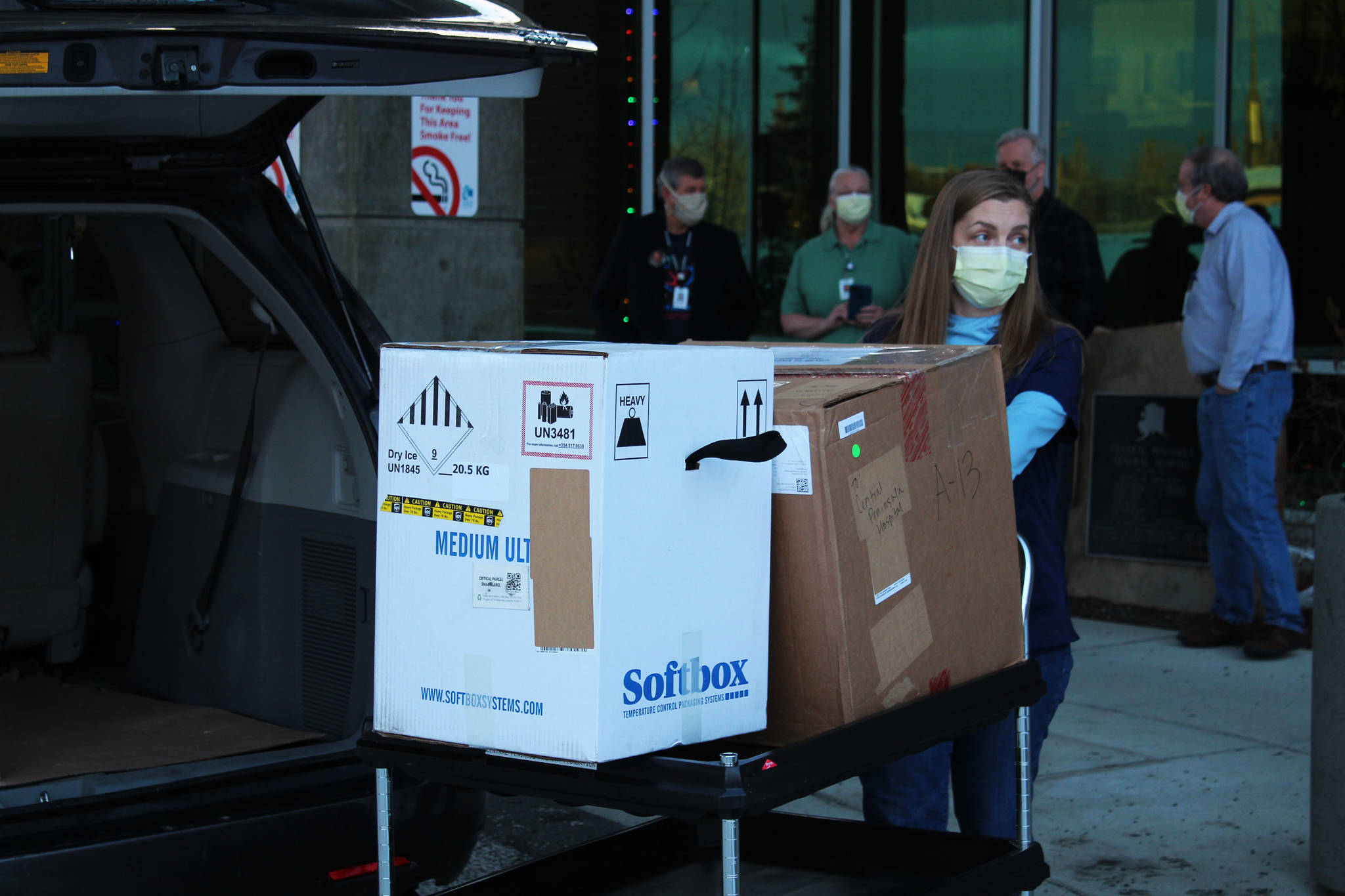 Ashlyn O’Hara / Peninsula Clarion
Central Peninsula Hospital Pharmacy Technician Jessica Hulet rolls a cart carrying doses of Pfizer’s COVID-19 vaccine into Central Peninsula Hospital in Soldotna on Wednesday.