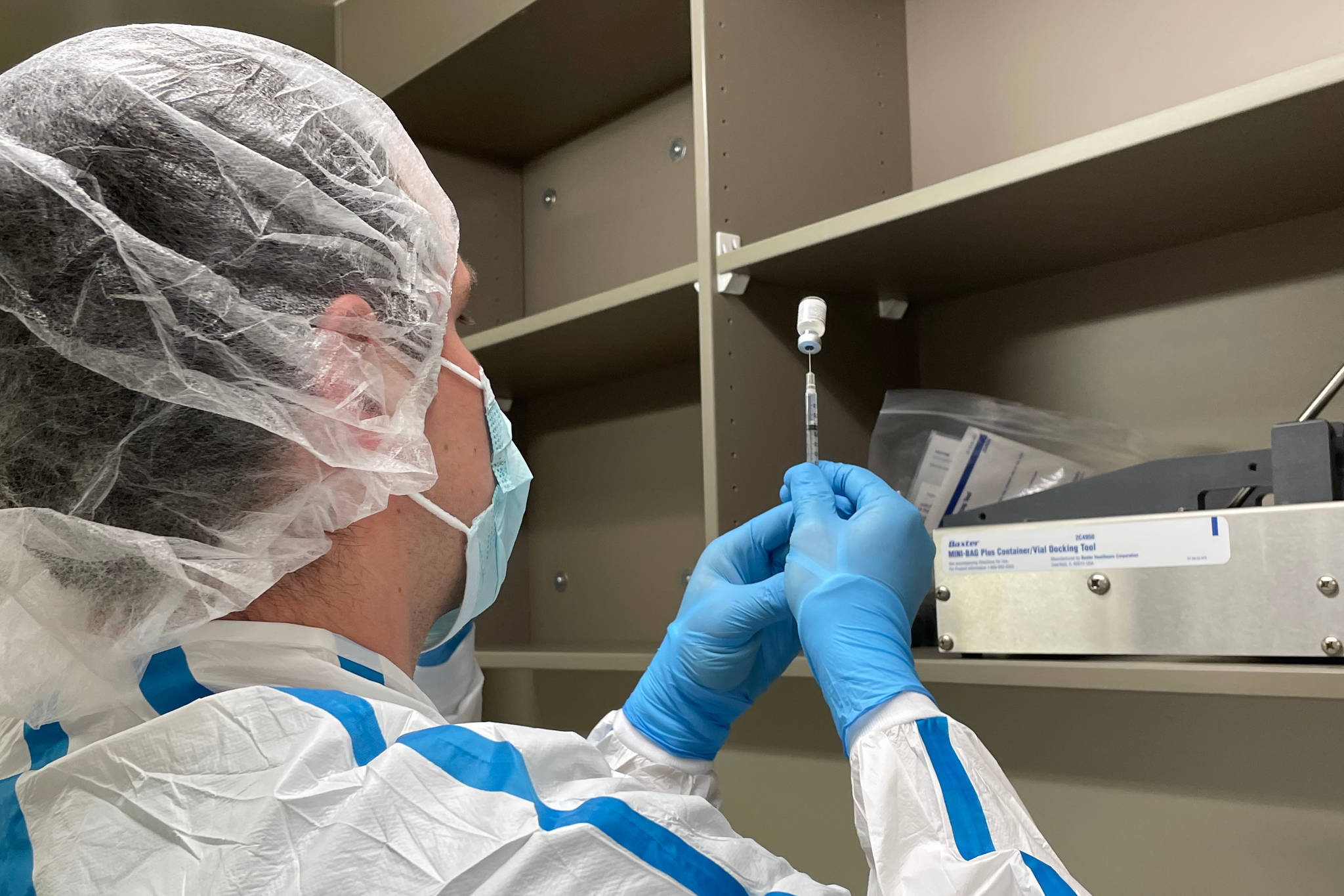 Krischelle Batac, a pharmacy technician with Bartlett Regional Hospital, prepares the first dose of the Pfizer/BioNTech coronavirus vaccine on Dec. 15, 2020. (Courtesy photo / Katie Bausler)