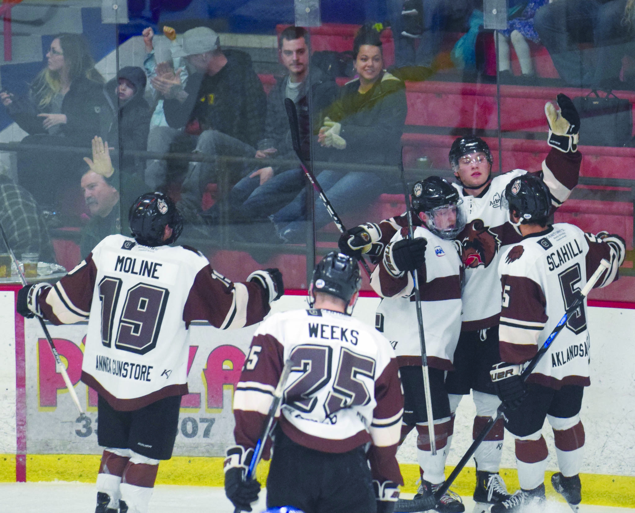 Jeff Helminiak / Peninsula Clarion
Kenai River Brown Bears forward Brandon Lajoie (arm raised) celebrates his first-period goal on Jan. 17 against the Maine Nordiques at the Soldotna Regional Sports Complex.