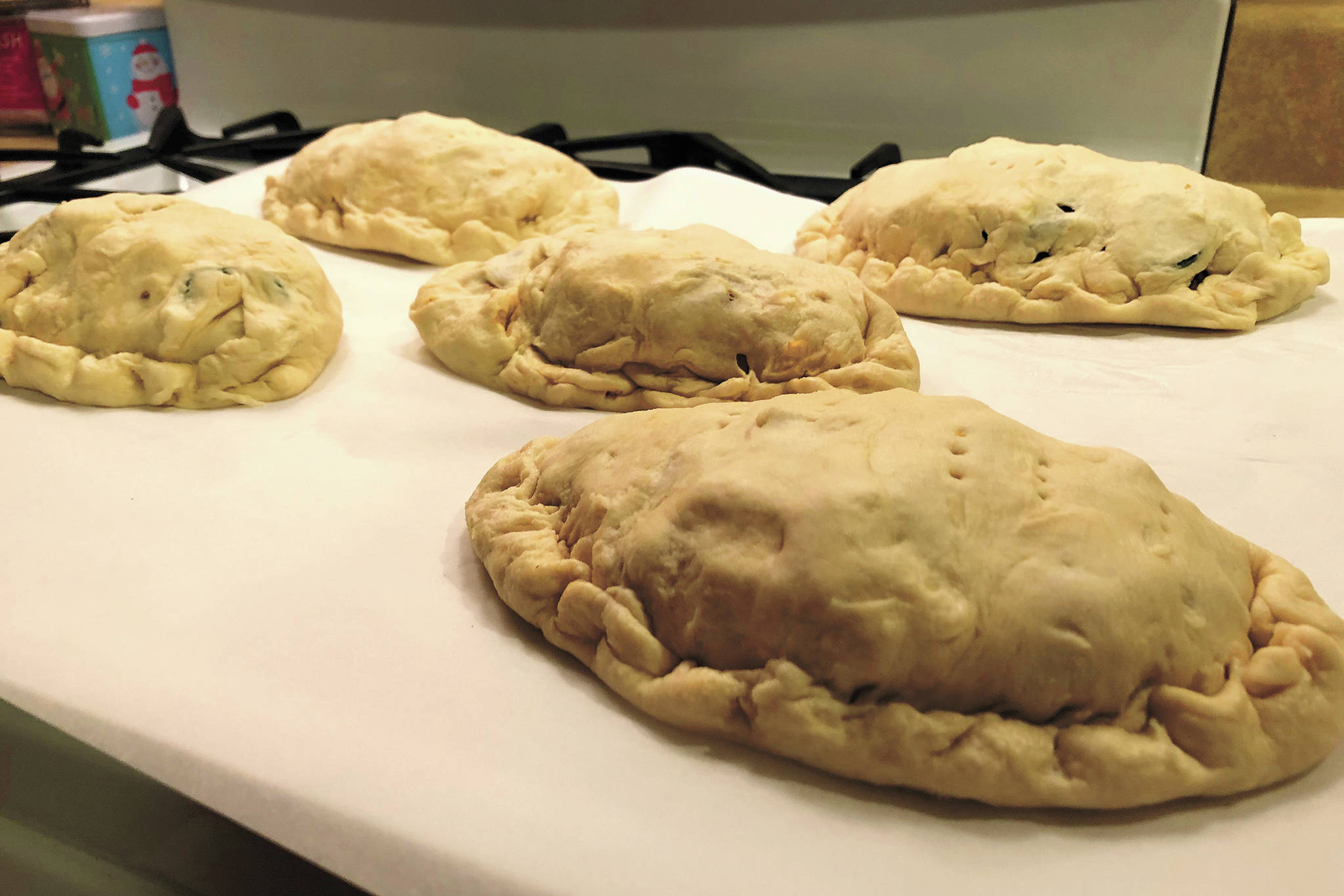 The dough for this batch of pasties was stickier than usual, resulting in less than perfect formation and crimping, seen here Christmas Day, Dec. 25, 2020 in Crystal Falls, Michigan. An example of substance over style. (Photo by Megan Pacer/Homer News)
