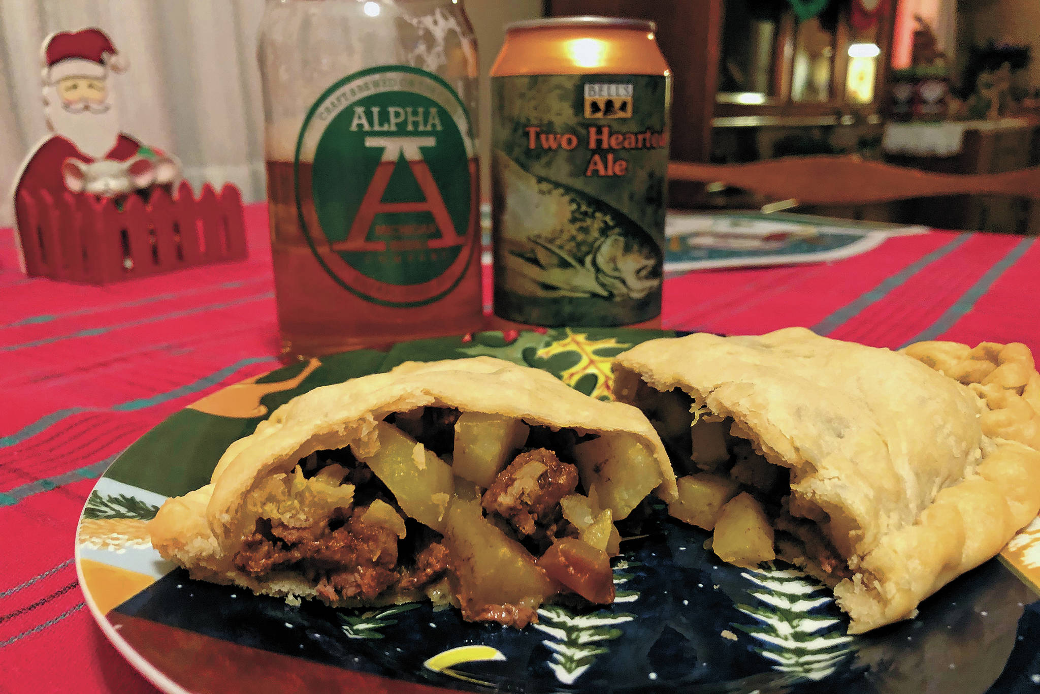 The finished product should have a light, flaky crust and moist fillings, as seen here on Christmas Day, Dec. 25, 2020 in Crystal Falls, Michigan. Finished off with a Michigan made beer, it’s hard to find a better second lunch/early dinner on Christmas Day. (Photo by Megan Pacer/Homer News)