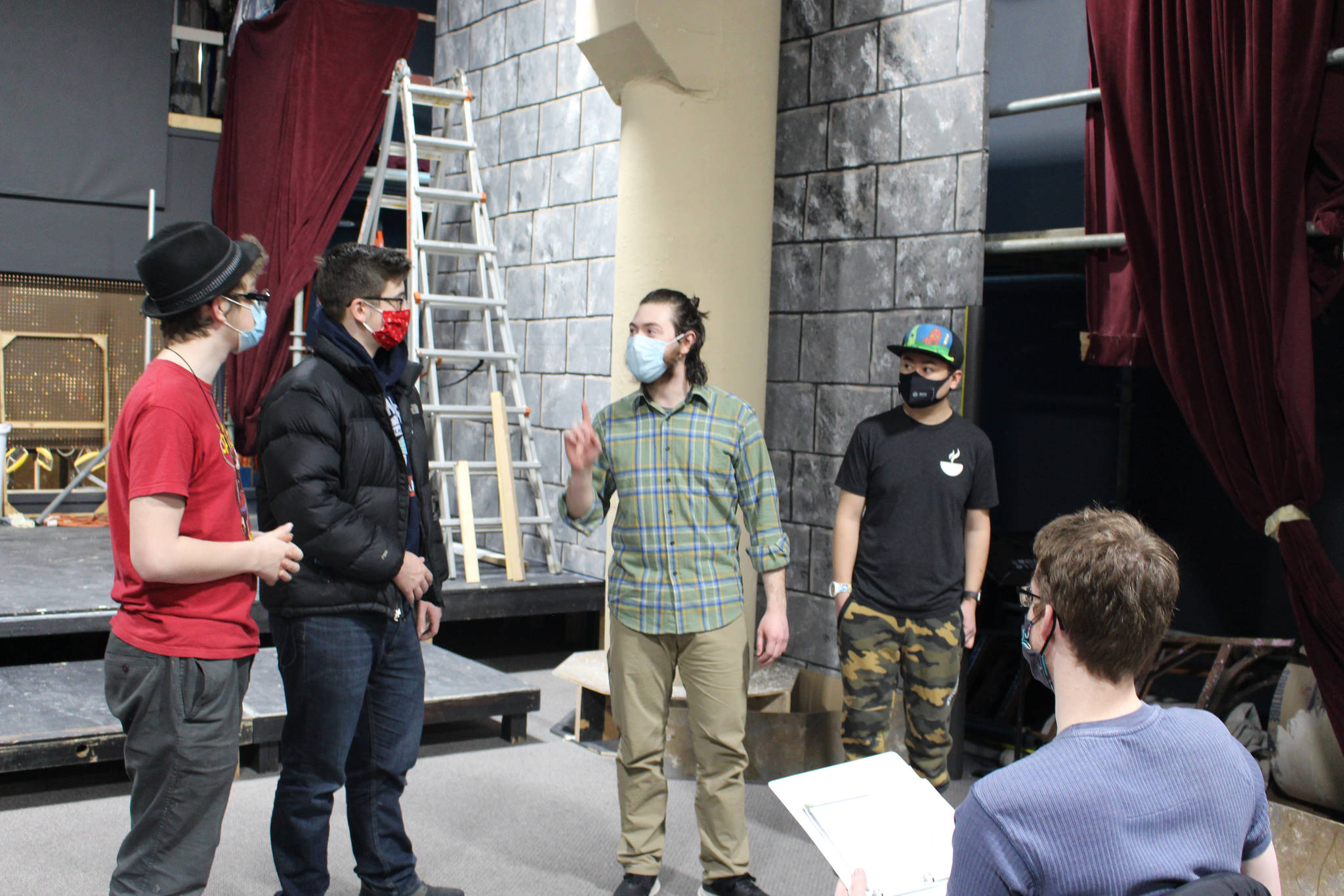 Members of the Kenai Performers rehearse a scene from “Murder in the Cathedral” at the Kenai Performers black box theater in Soldotna, Alaska, on Jan. 16, 2021. From left: Josiah Burton, Jaron Swanson, Raleigh Van Natta, Spring Sibayan and director Paul Morin. (Photo by Brian Mazurek/Peninsula Clarion)