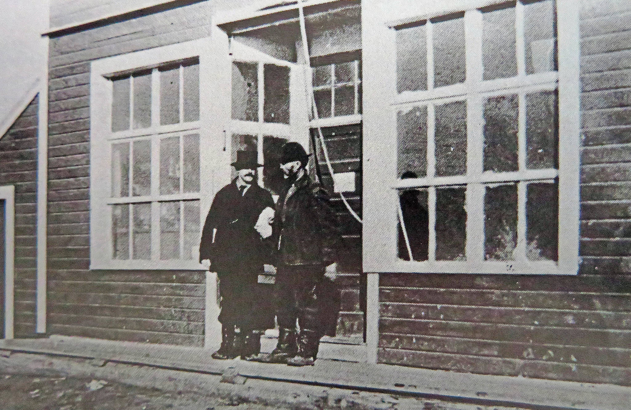 Photo from “Once Upon the Kenai” 
William N. Dawson chats with Captain Rose, of the S.S. Tyonic, in front of Dawson’s Kenai store in 1915.