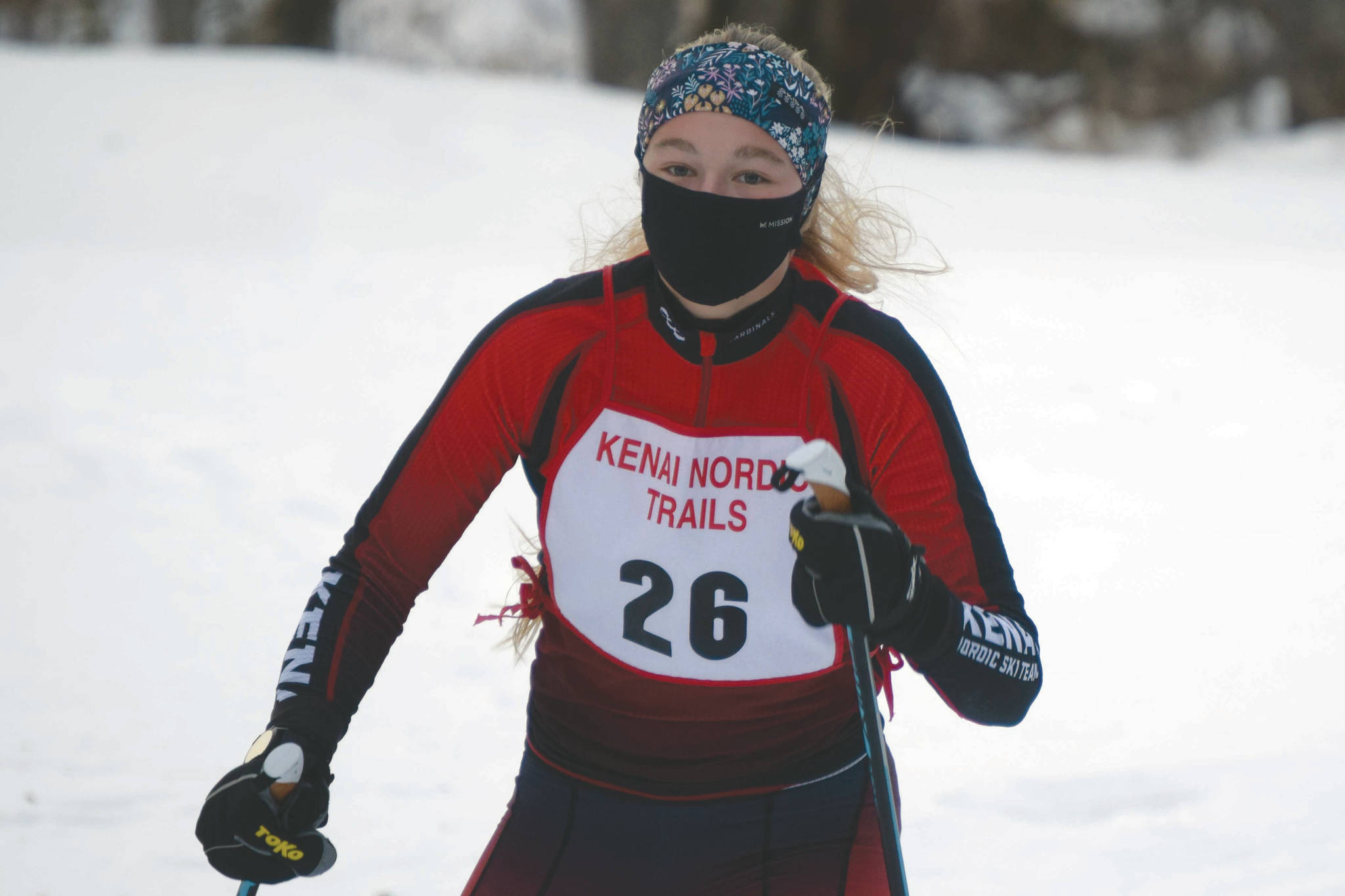 Kenai Central's Emily Moss takes the victory in the girls race at the Kenai Nordic Trails on Saturday, Jan. 16, 2021, at Kenai Golf Course. (Photo by Jeff Helminiak)