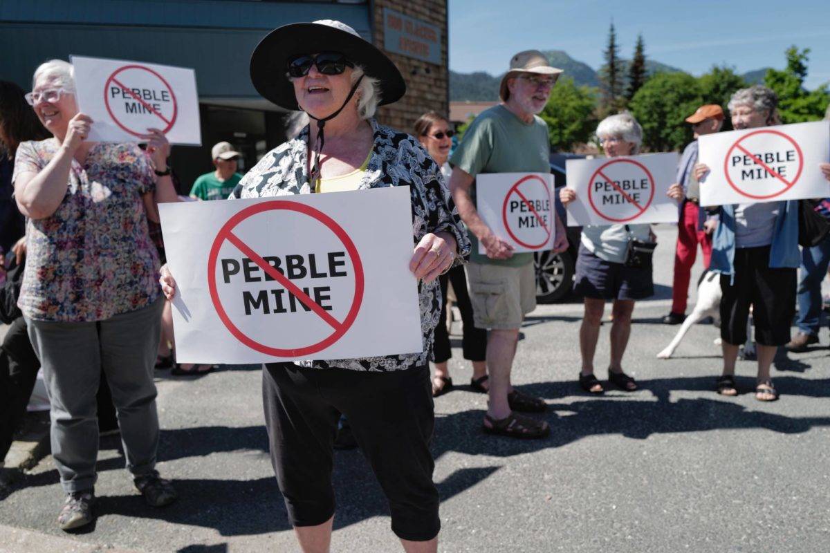 Judy Cavanaugh stands with others at a rally against the Pebble Mine in front of Sen. Lisa Murkowskis Juneau office on Tuesday, June 25, 2019. (Michael Penn / Juneau Empire File)