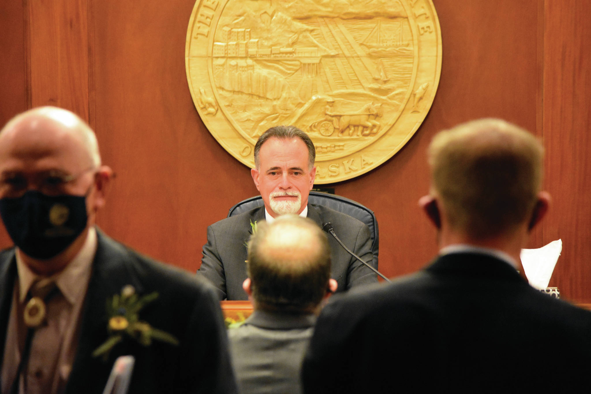 Senate President Peter Micciche, R-Soldotna, has his picture taken by a fellow senator after being unanimously elected on the first day of the 32nd Alaska Legislature on Tuesday, in Juneau. (Peter Segall/The Juneau Empire via AP, Pool)
